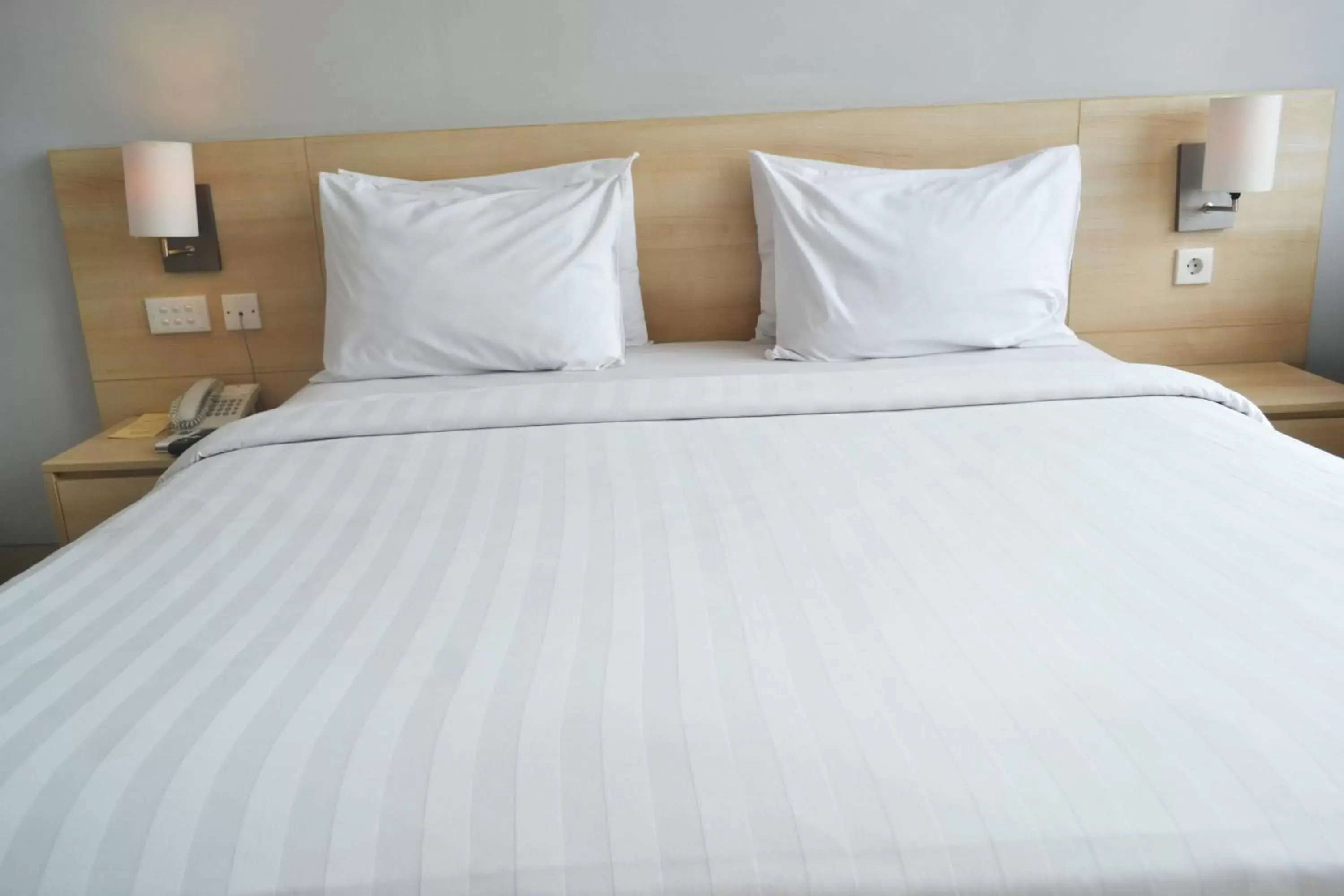 Bed in Grand Cakra Hotel Malang