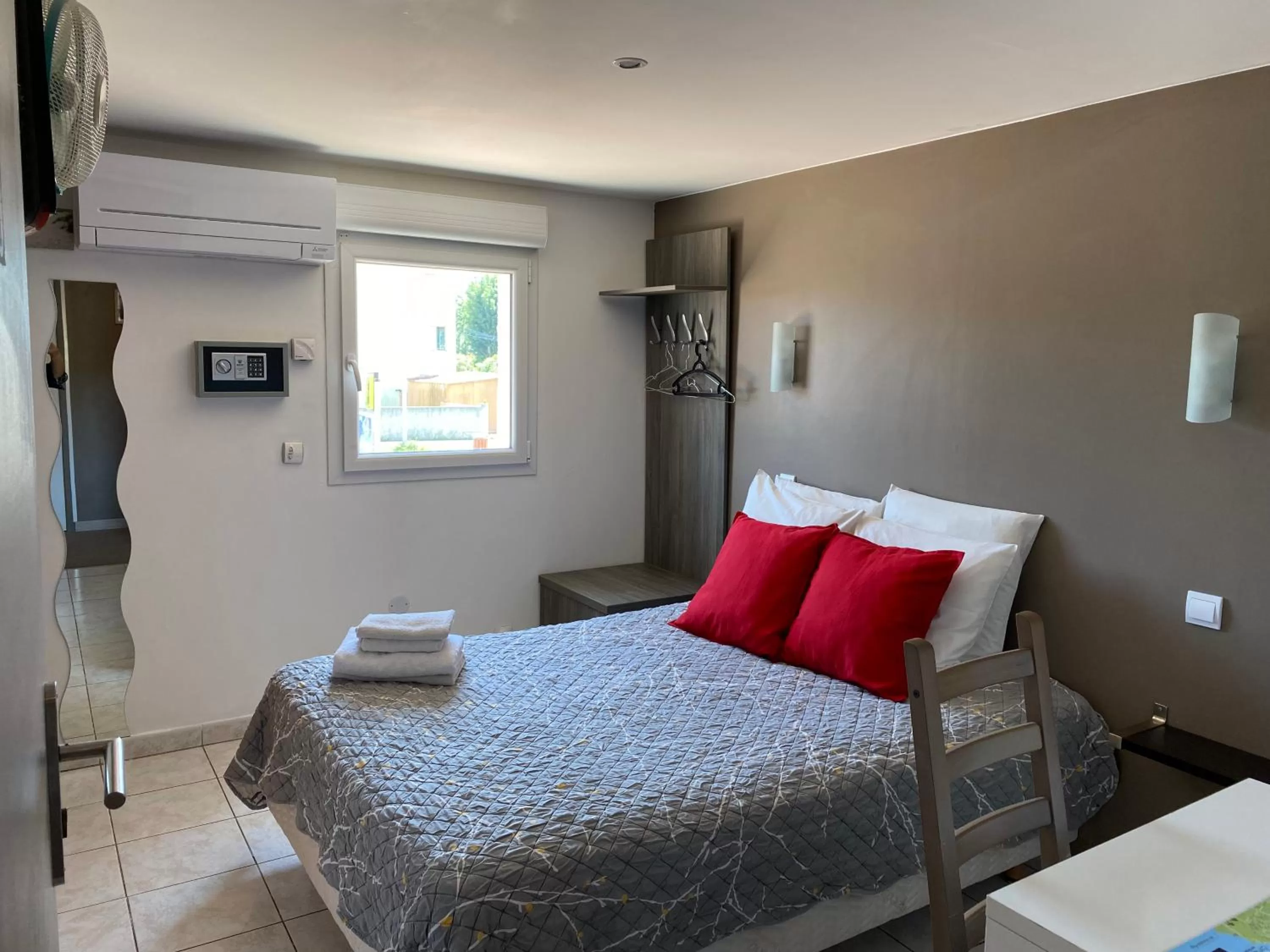 Bed in LOGIS Hôtel La Chaumière