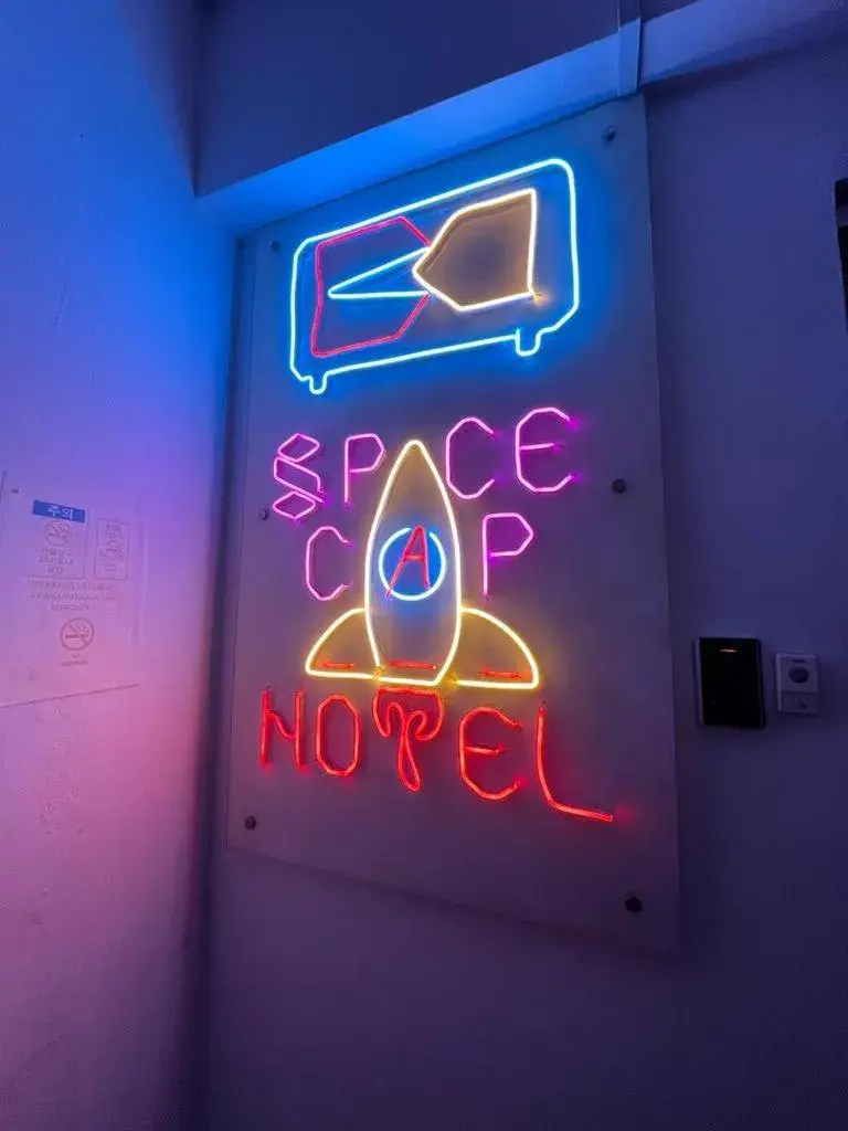 Property Logo/Sign in Space Cap Hotel