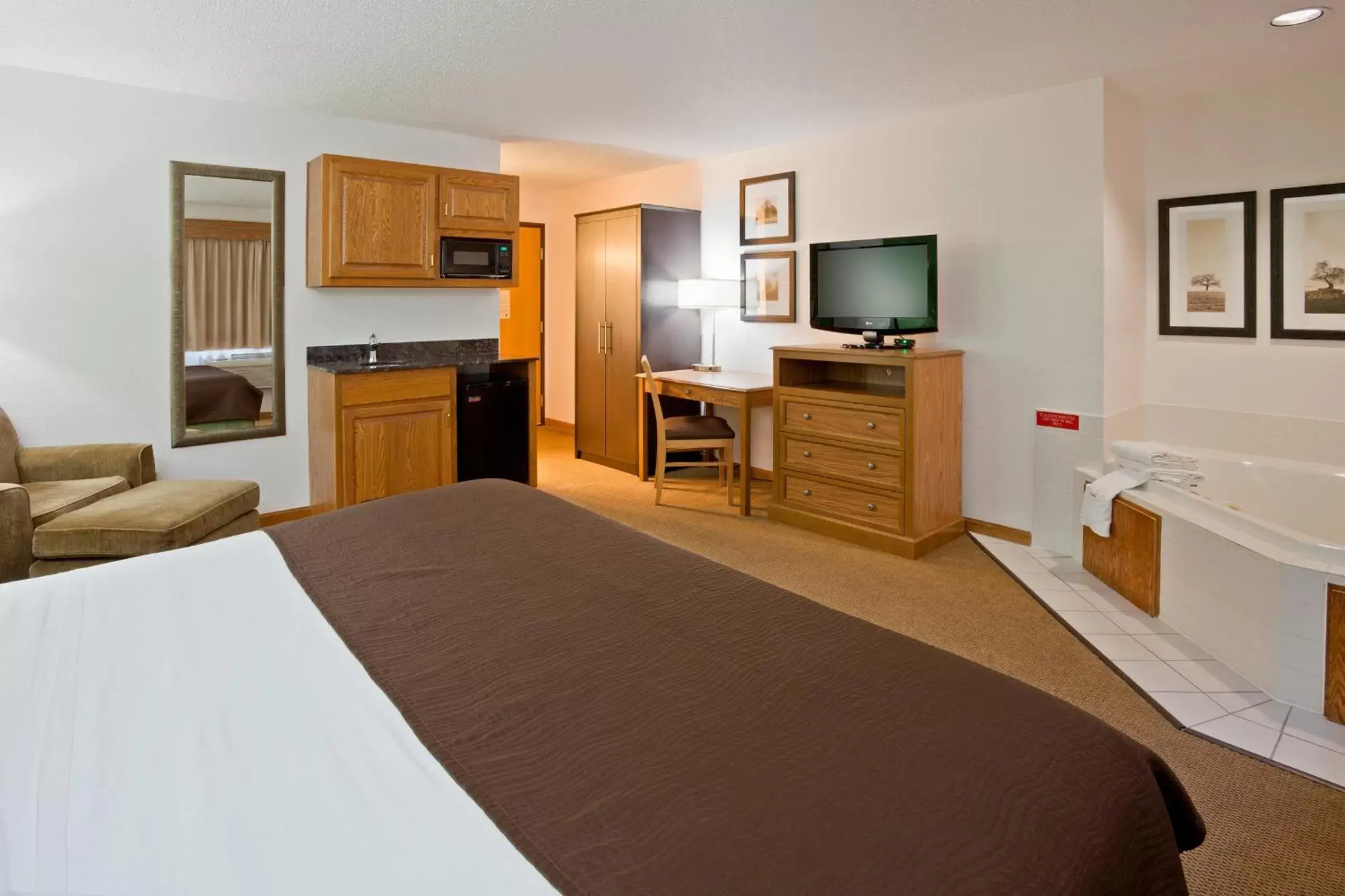 Photo of the whole room, Bed in AmericInn by Wyndham Eau Claire