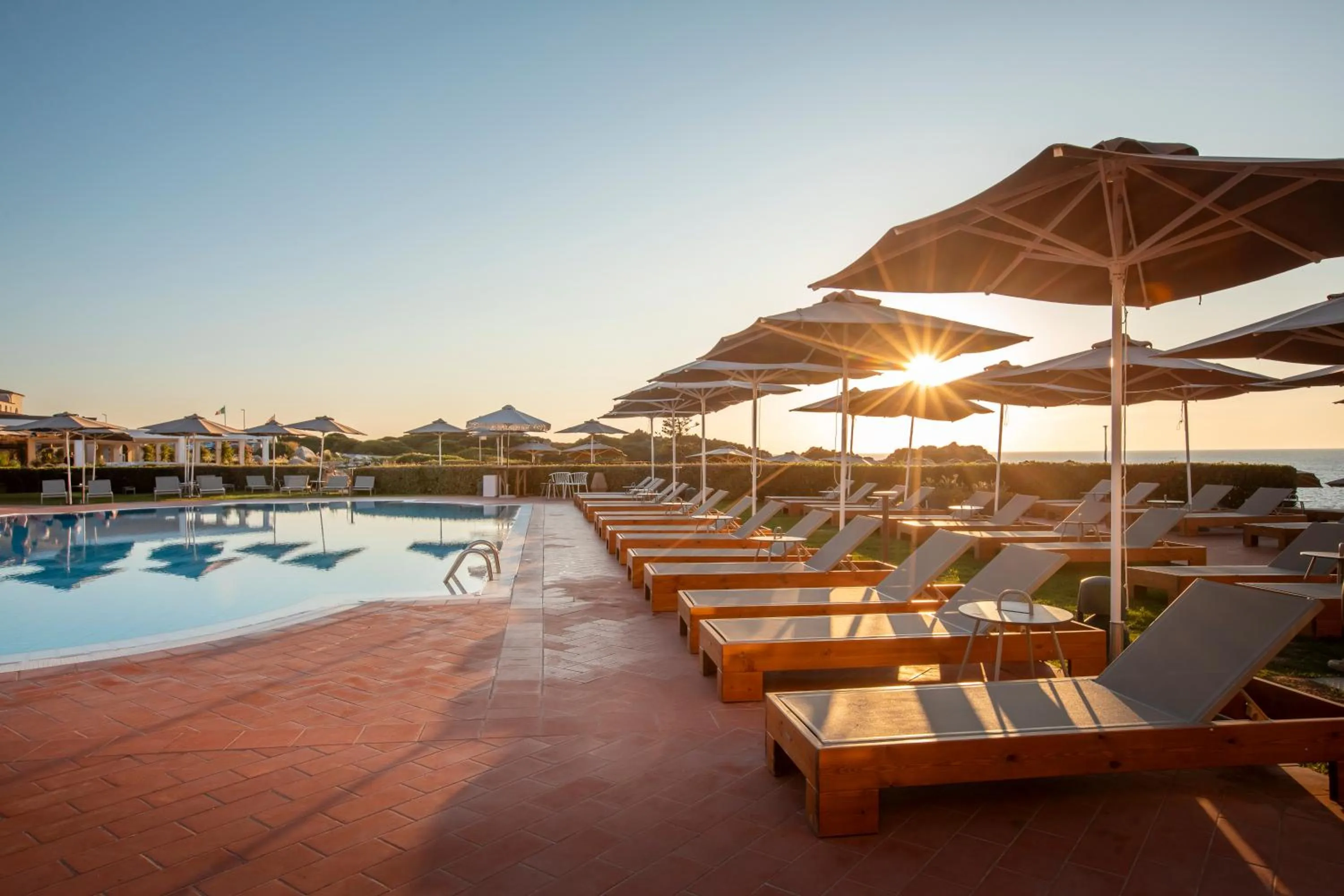 Swimming pool in Mangia's Santa Teresa Sardinia, Curio Collection by Hilton