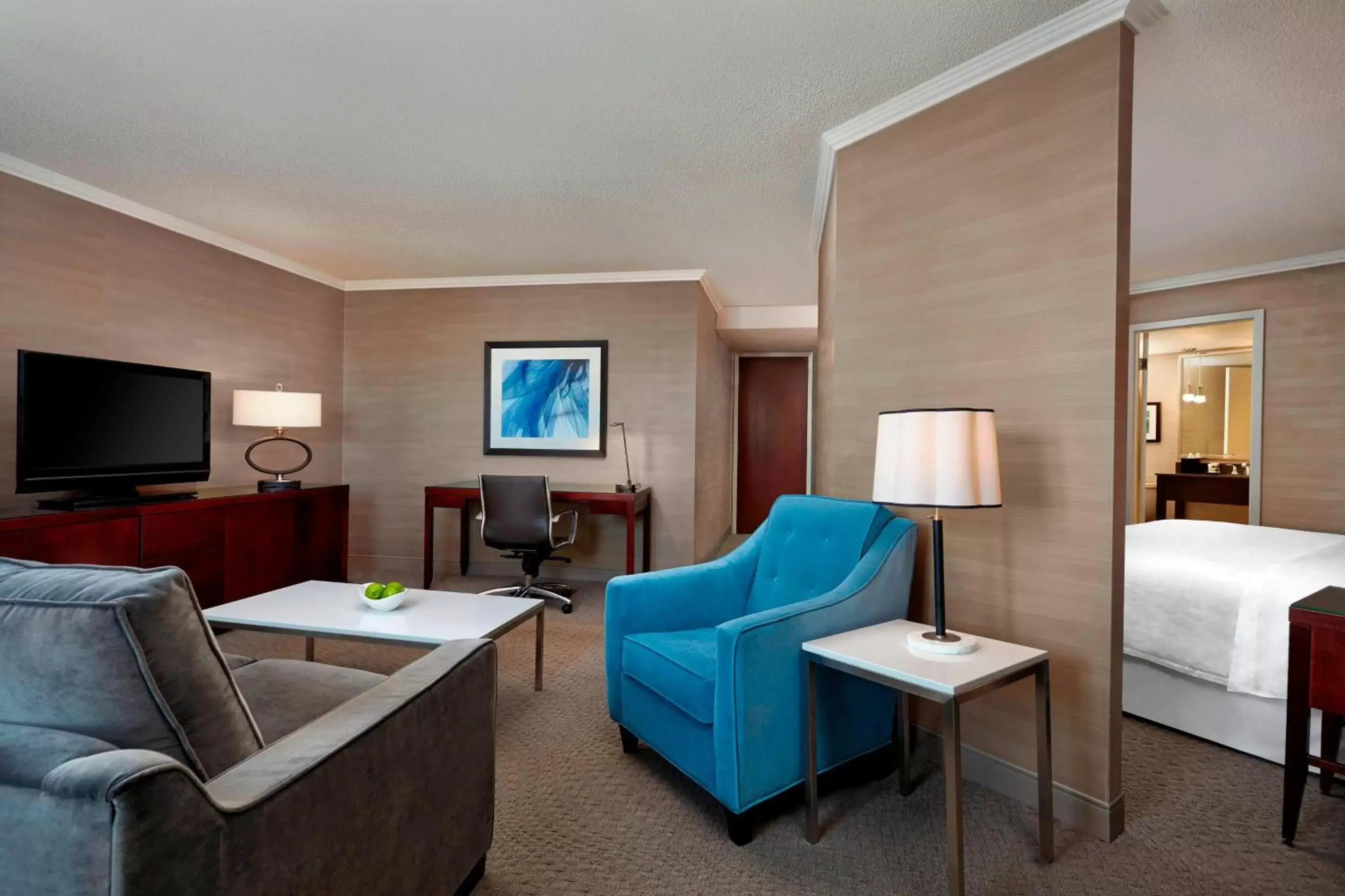 Bedroom, Seating Area in Sheraton Cavalier Calgary Hotel