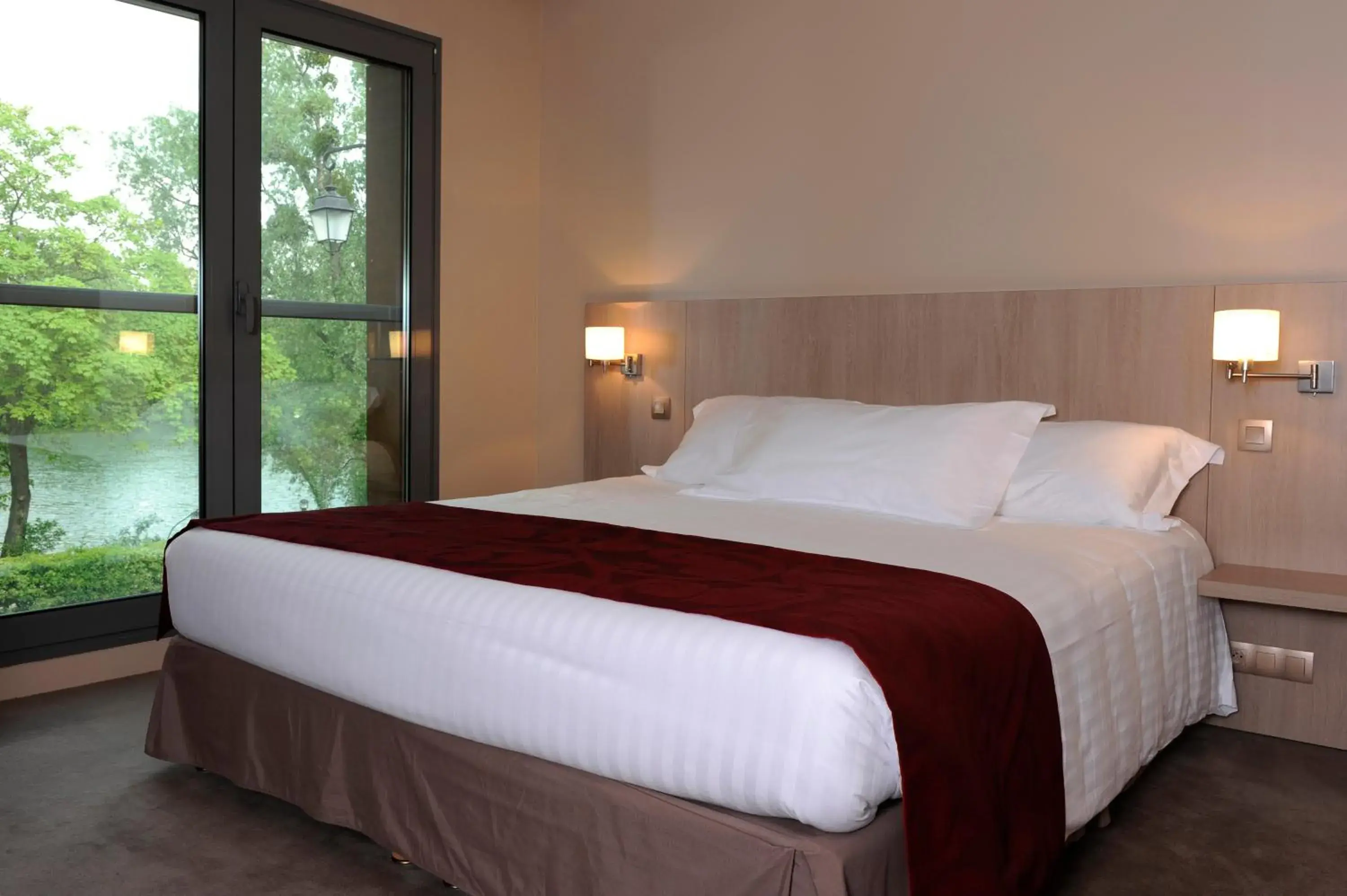 Bed in Relais De La Malmaison Paris Rueil Hotel-Spa