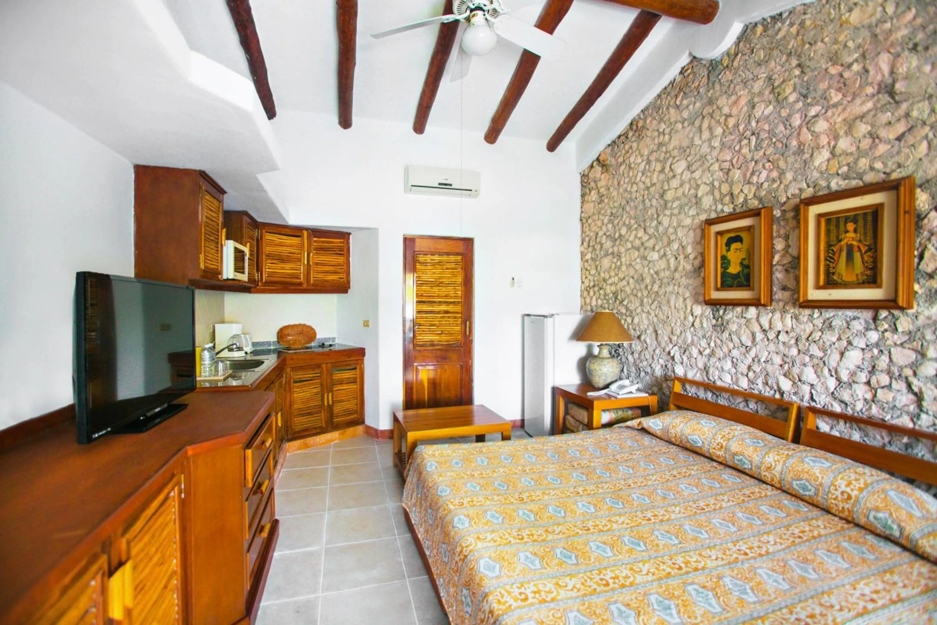 Living room, Bed in Casa del Mar Cozumel Hotel & Dive Resort with free access to an exclusive beach club