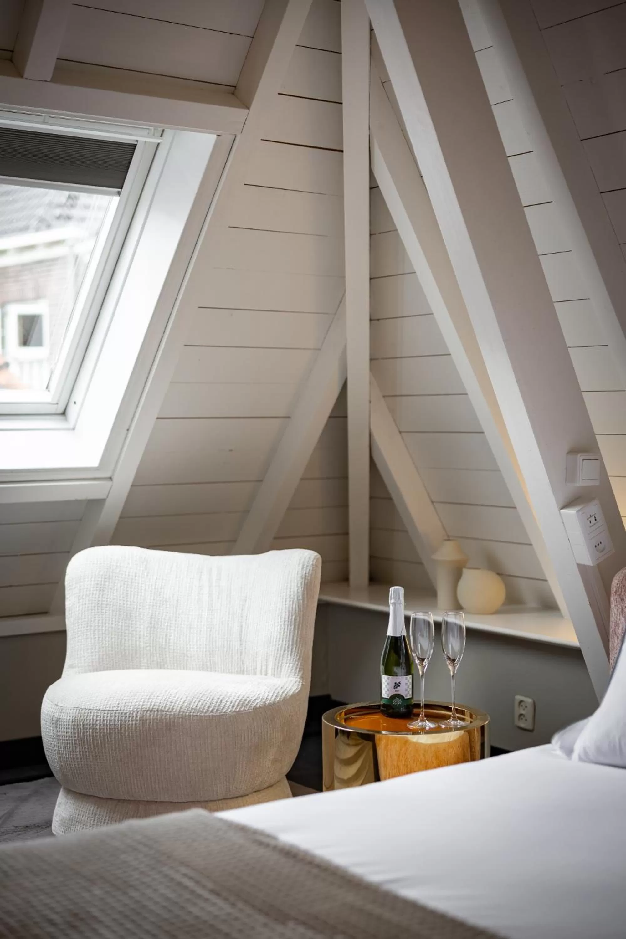 Bed, Seating Area in The Lemon Suites