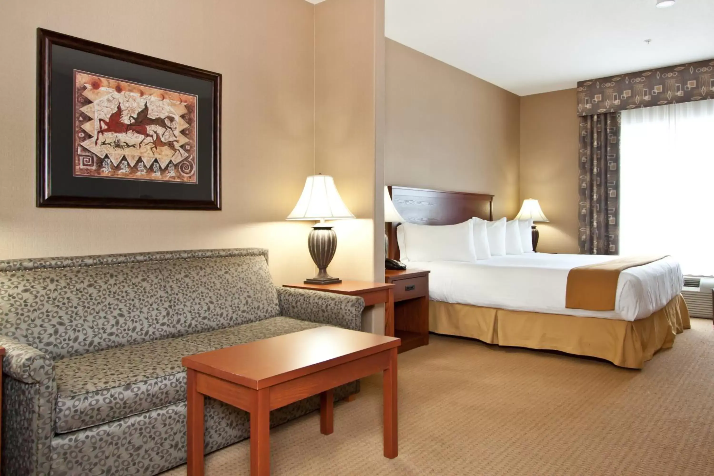 Living room, Bed in Days Inn & Suites by Wyndham Strathmore