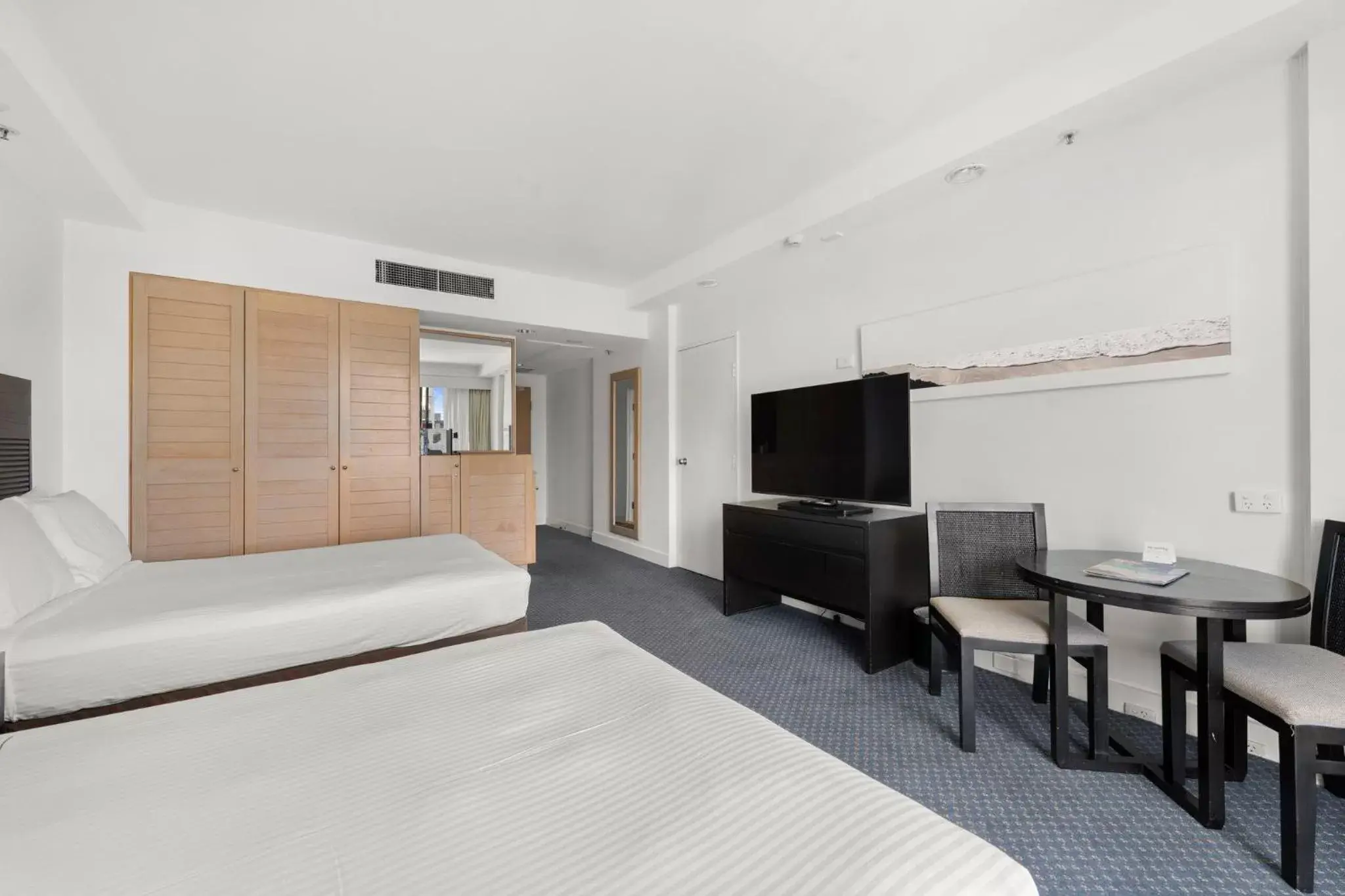 Photo of the whole room, TV/Entertainment Center in Crowne Plaza Surfers Paradise, an IHG Hotel