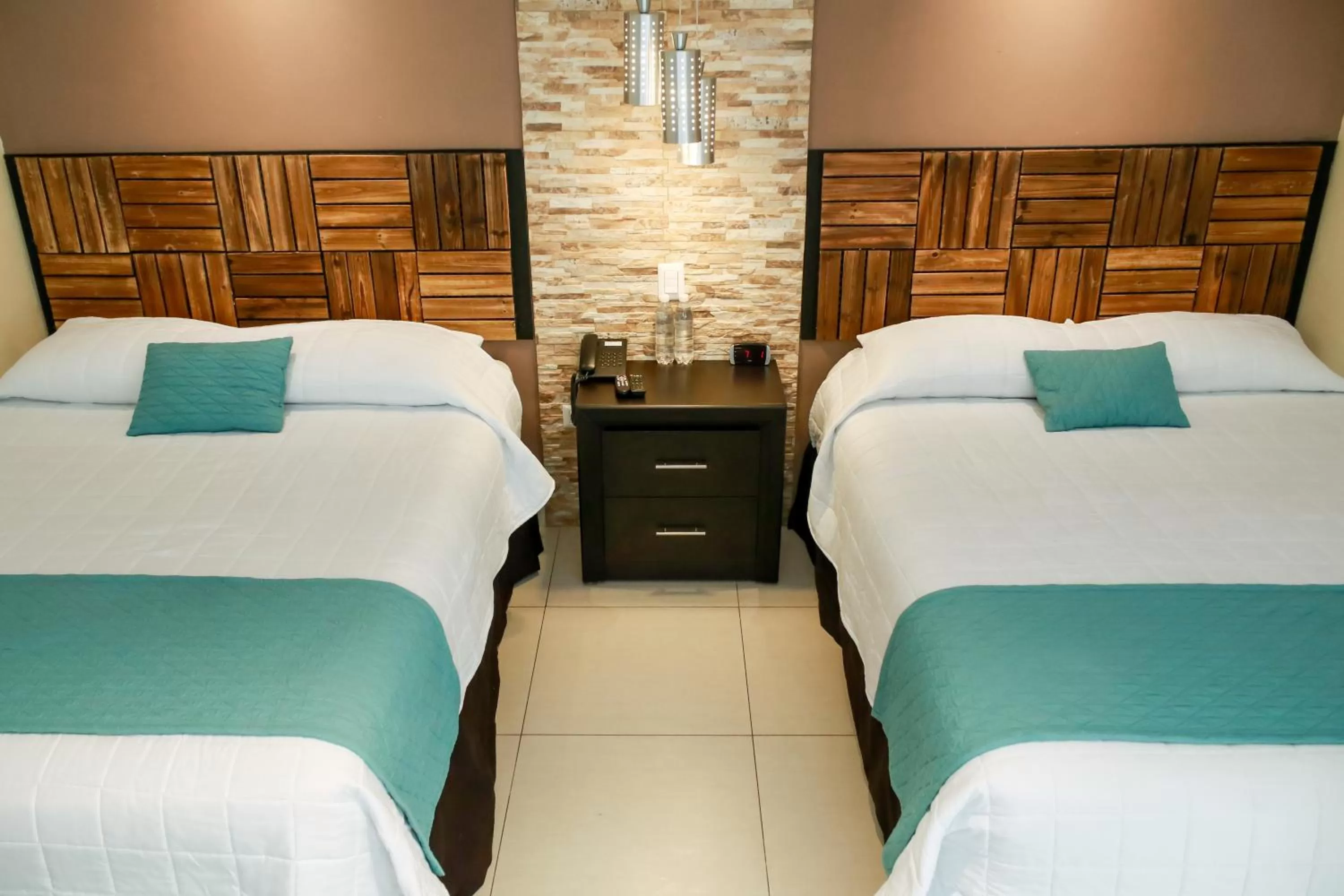 Bed in Las Magnolias Hotel Boutique