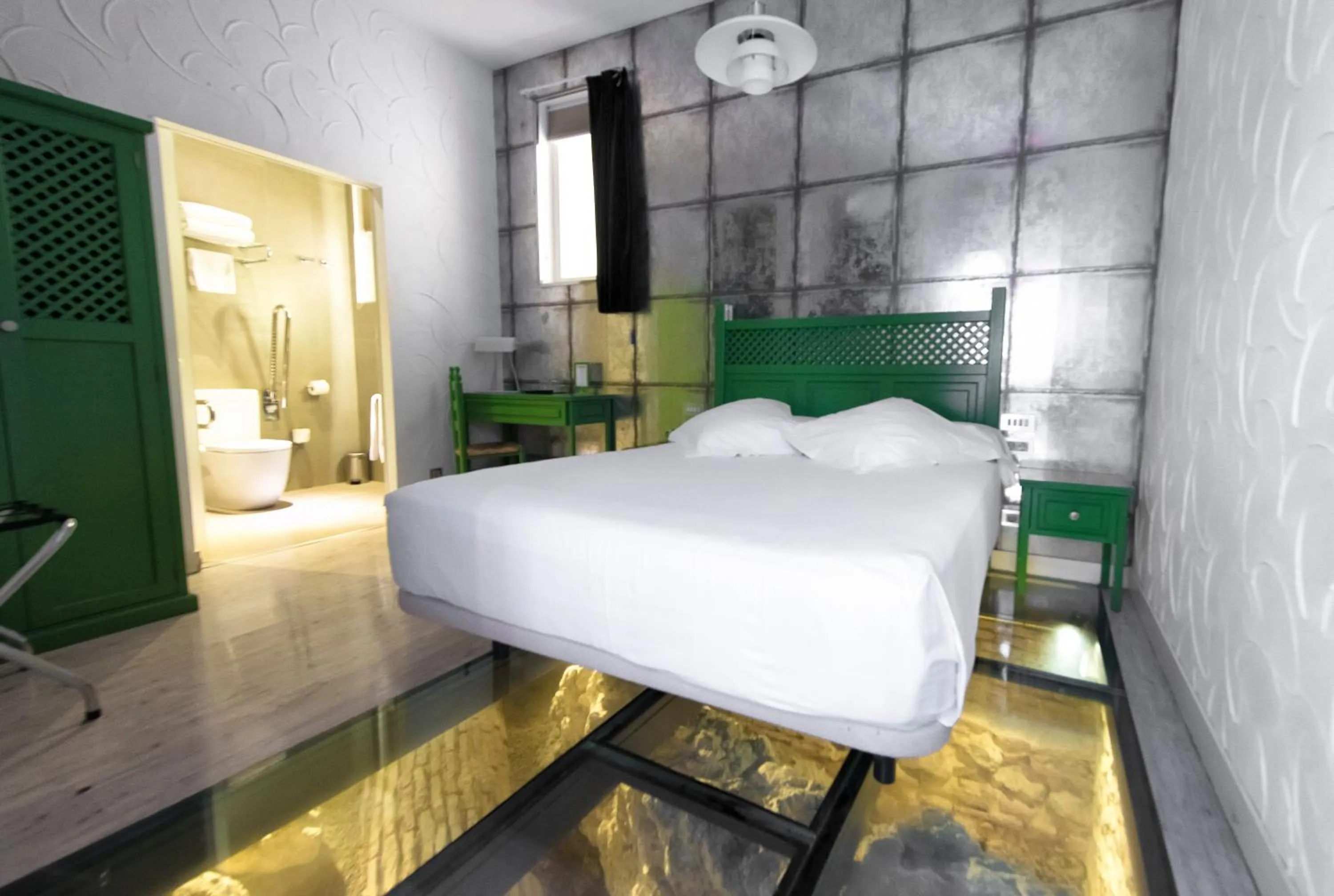 Bed in Posada del Dragón Boutique Hotel