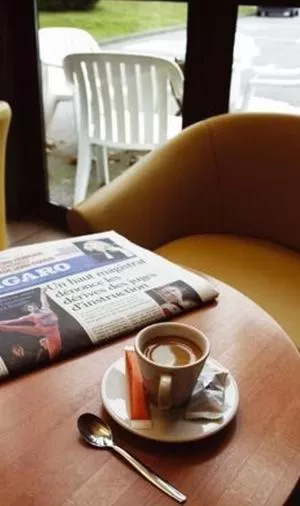 Seating area in Hôtel Novalis Quimperlé