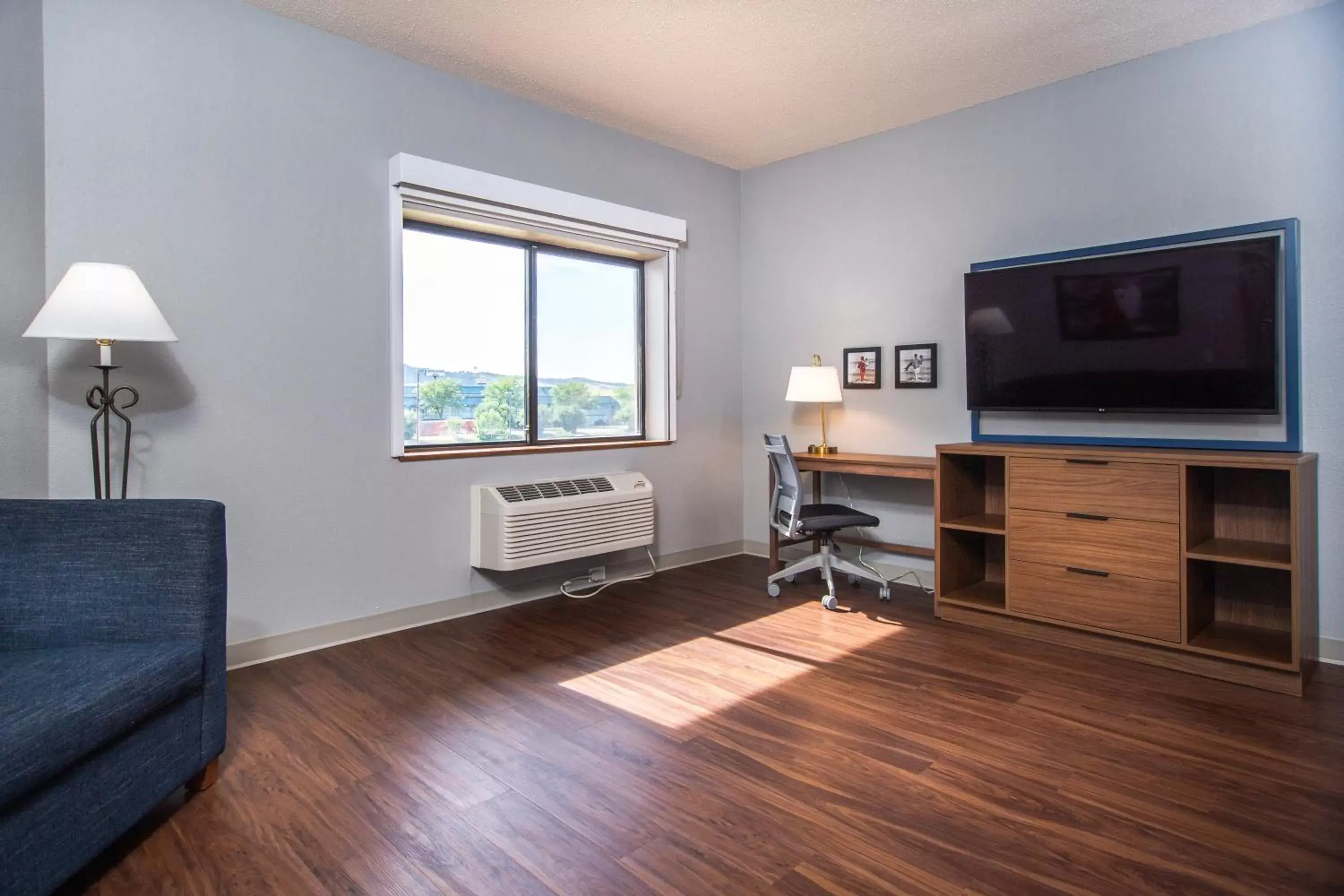 Seating area, TV/Entertainment Center in AmericInn by Wyndham Rapid City