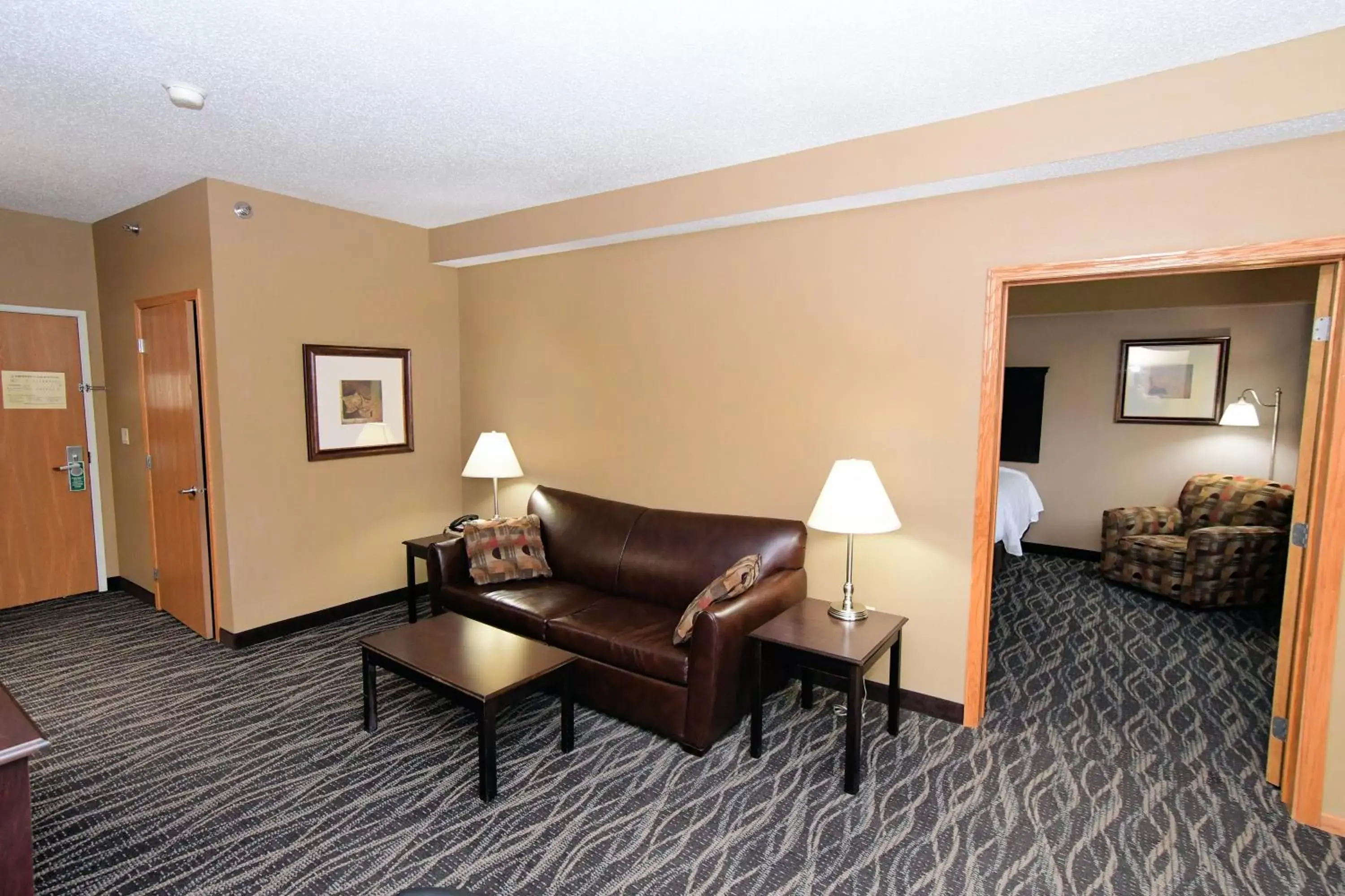 Bed in Cobblestone Inn & Suites - Denison | Majestic Hills