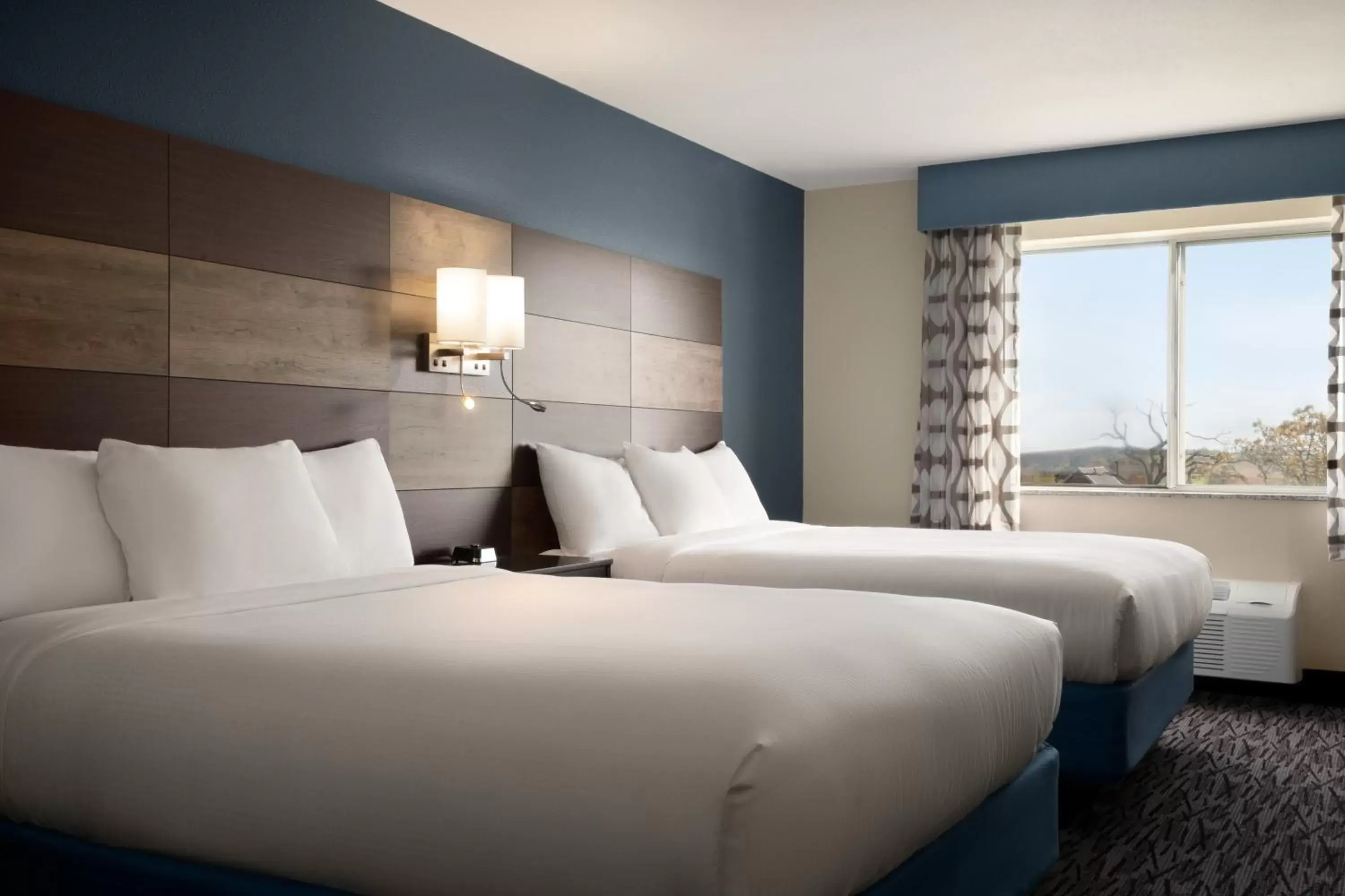 Guests, Bed in AmericInn by Wyndham Dodgeville