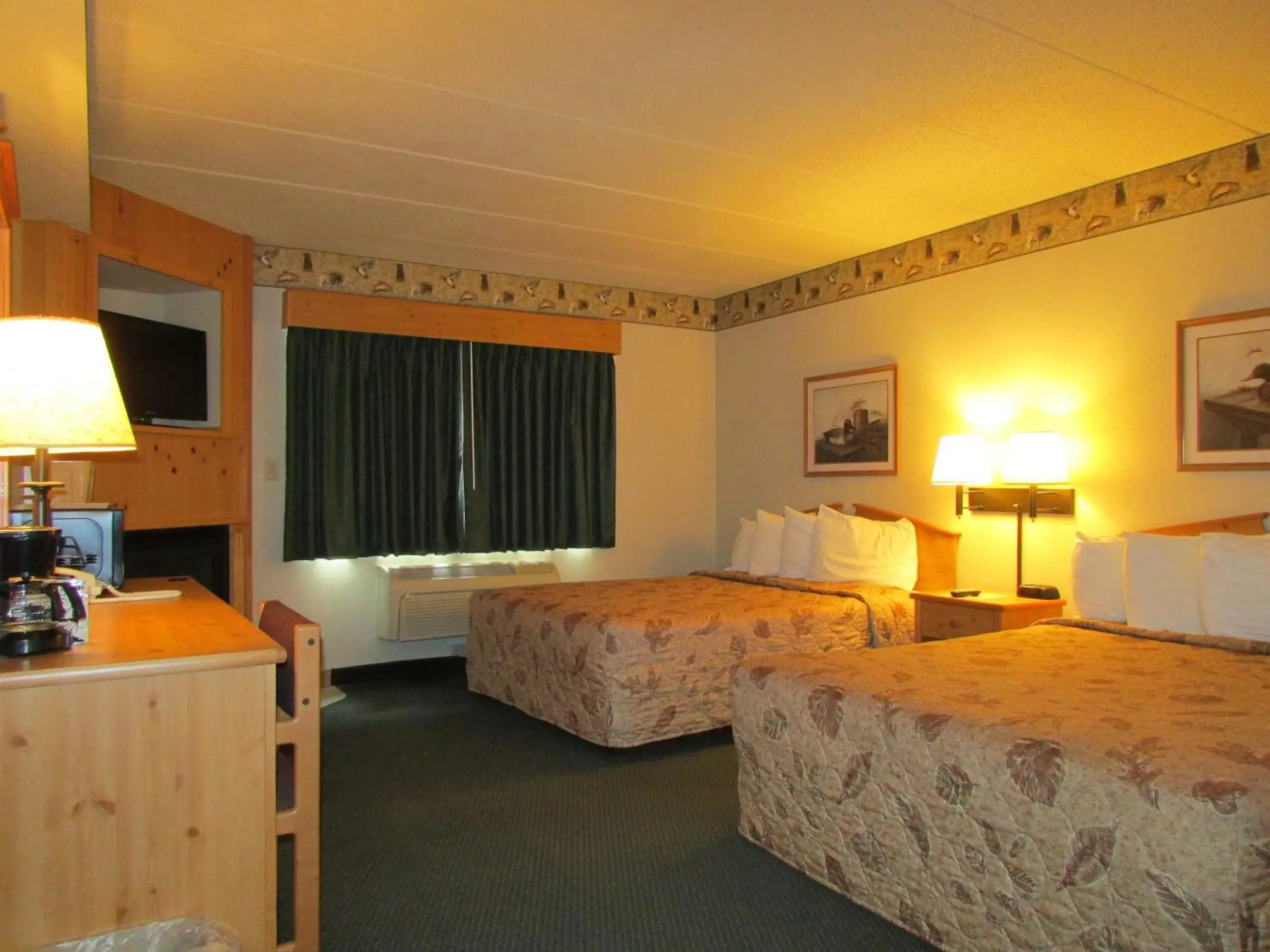 Queen Room with Two Queen Beds and Fireplace in AmeriVu Inn & Suites