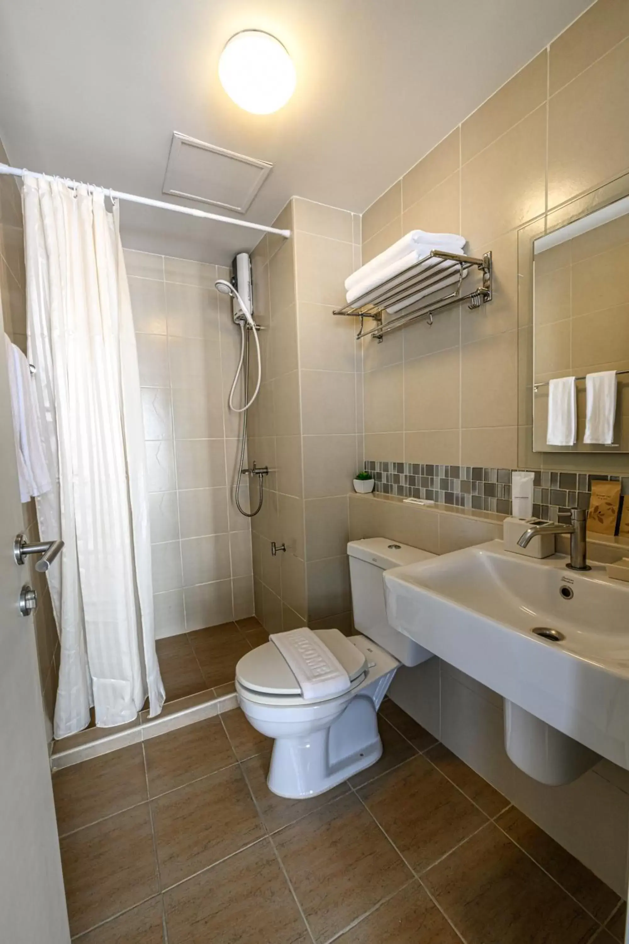 Toilet, Bathroom in First Choice Suites SHA Plus Extra