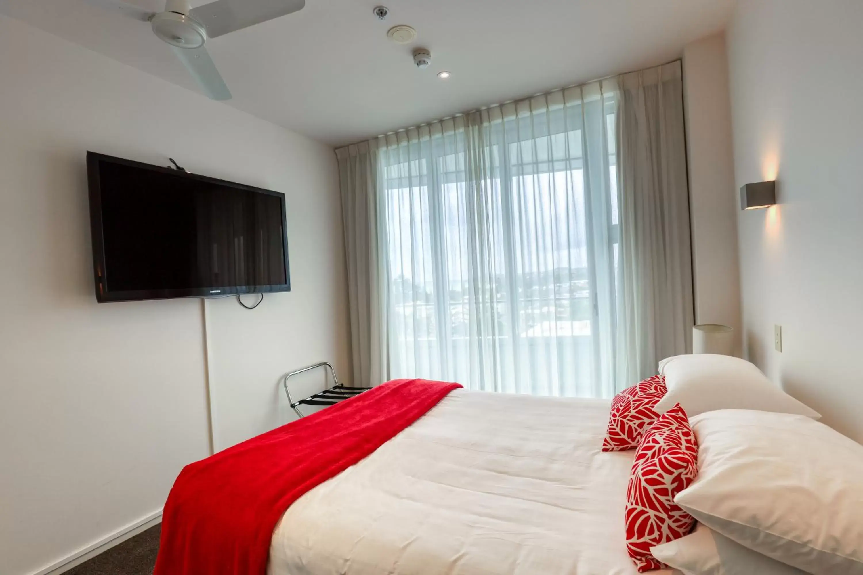Bedroom, Bed in Ramada Suites by Wyndham Nautilus Orewa