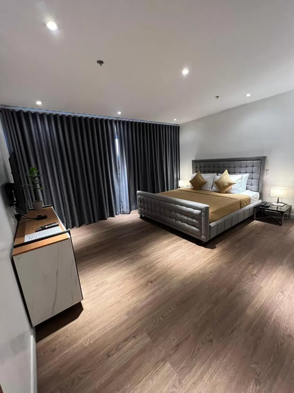 Bed in City Park Hotel Residences