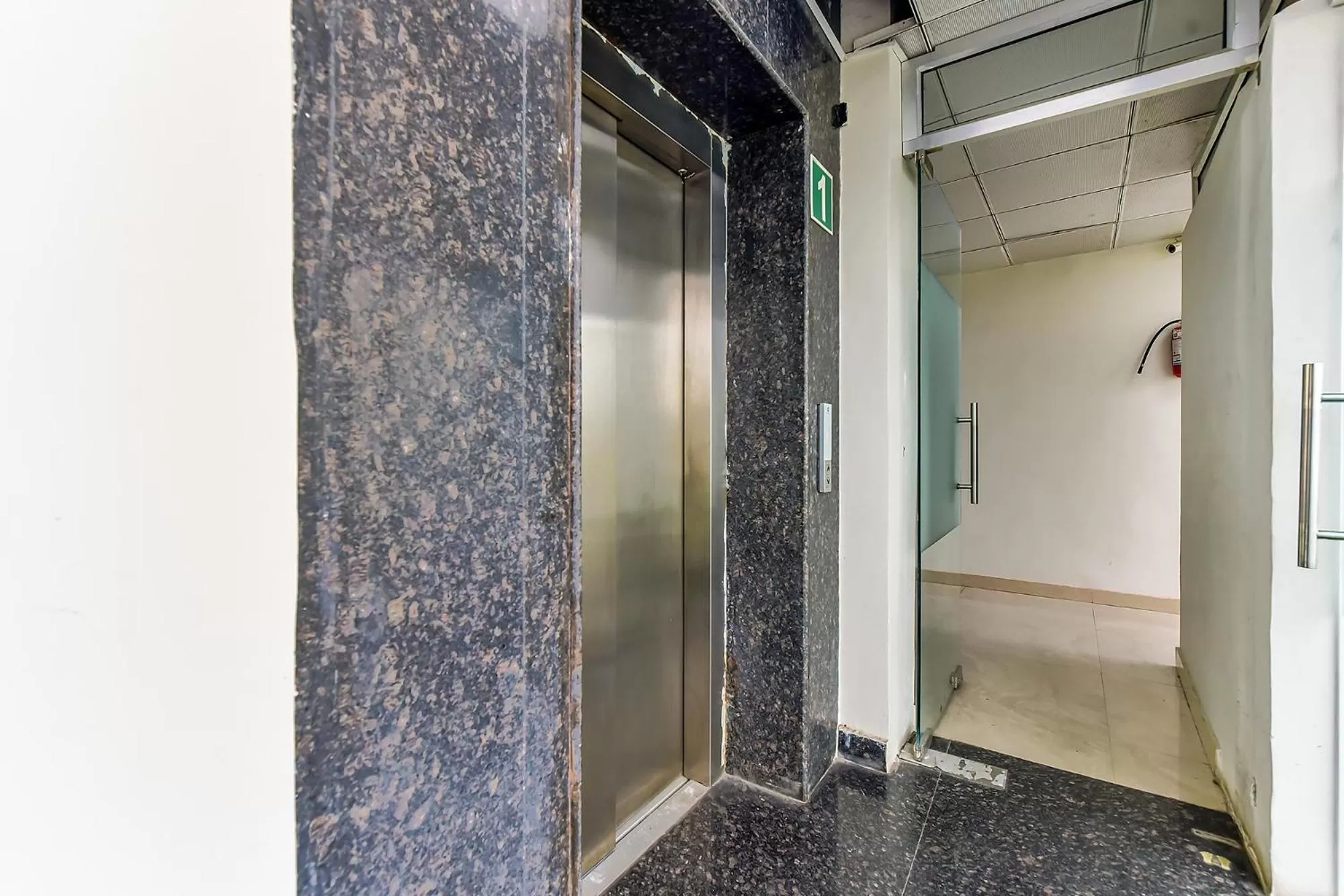 elevator, Bathroom in FabHotel Surya Residency GMS Road