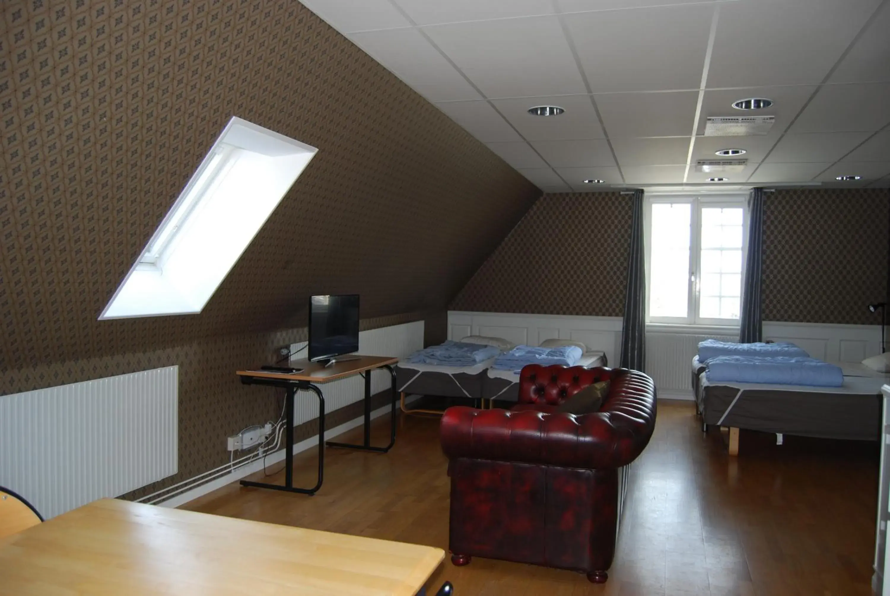 Bed, Seating Area in Halmstad Hotell & Vandrarhem Kaptenshamn