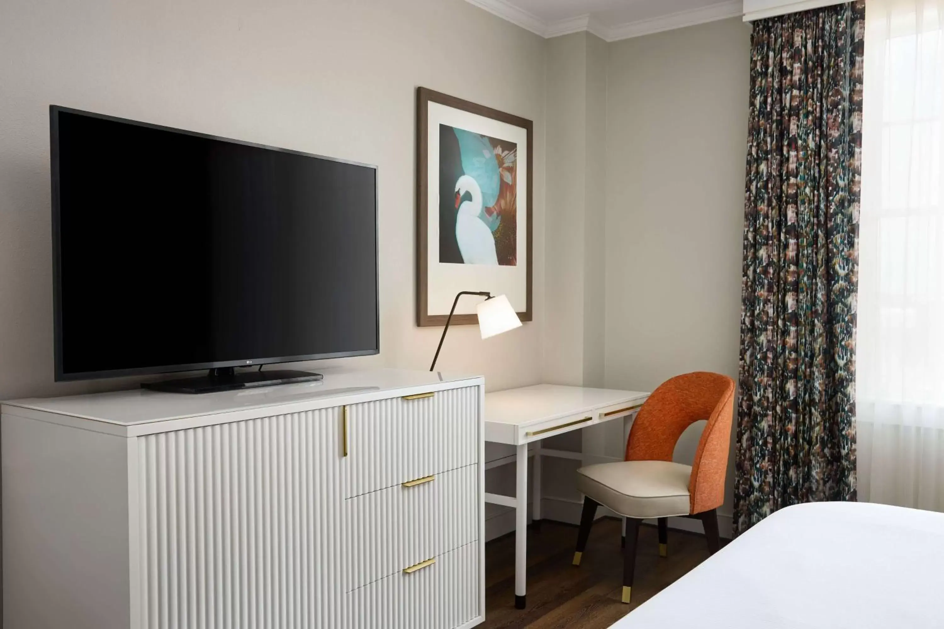 Bedroom, TV/Entertainment Center in The Terrace Hotel Lakeland, Tapestry Collection by Hilton