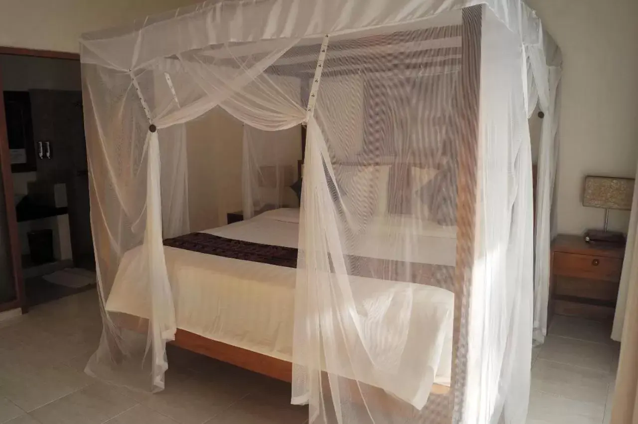 Bed in Puri Sari Beach Hotel