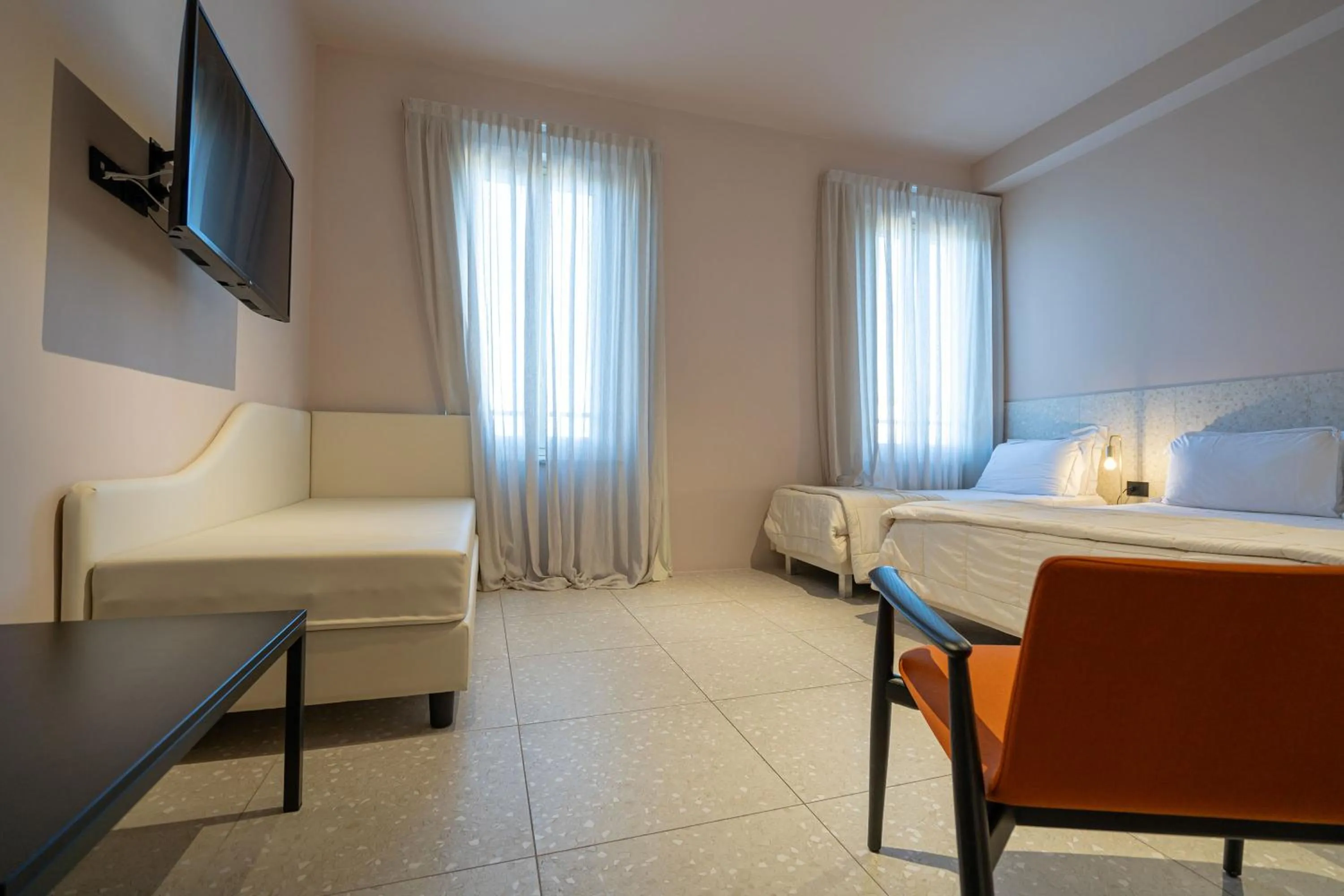 Bed in Elide Design Hotel