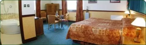 Bedroom in The Weigh Inn Hotel & Lodges