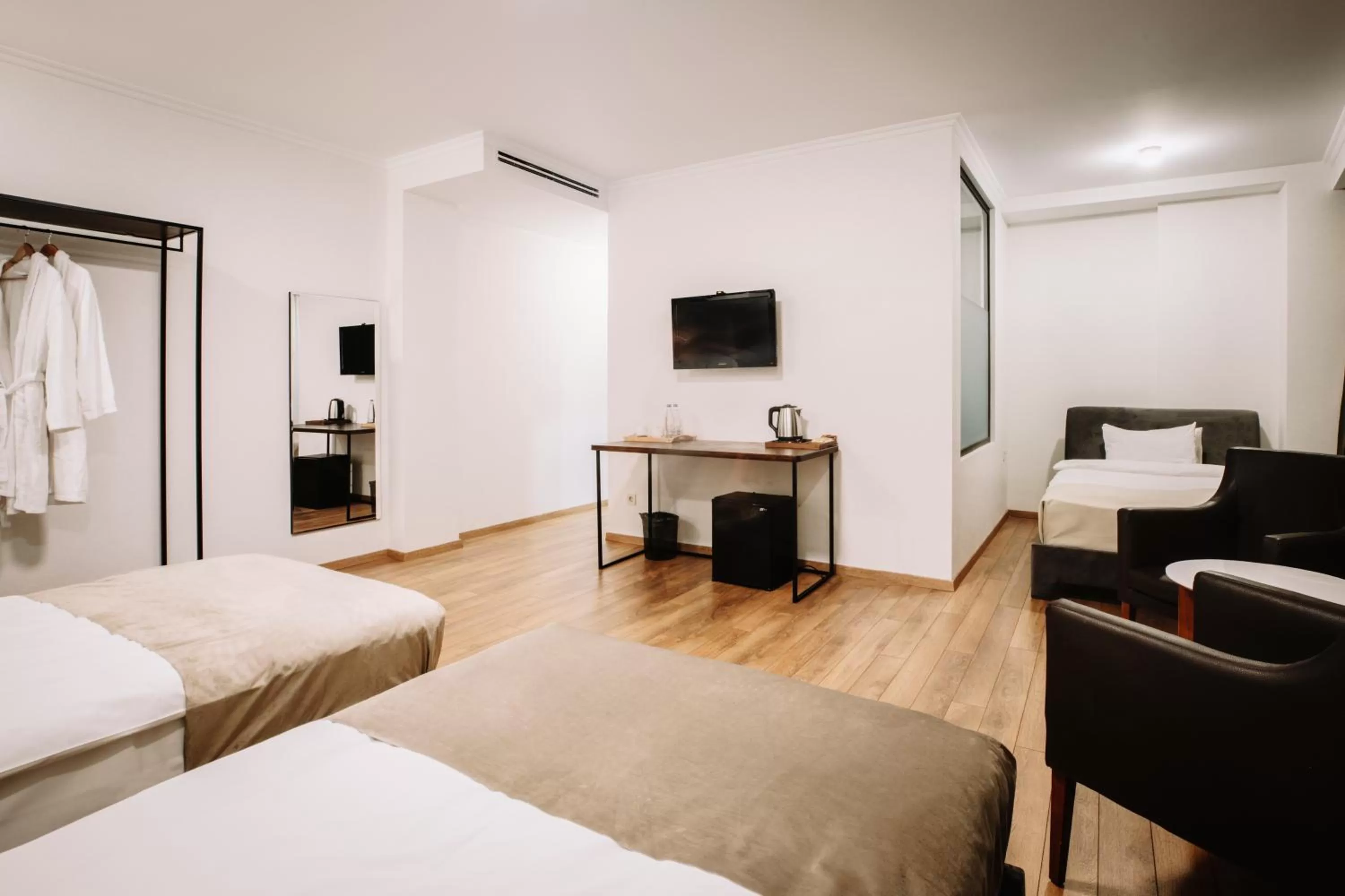 Communal lounge/ TV room, Bed in Citadel Narikala Hotel