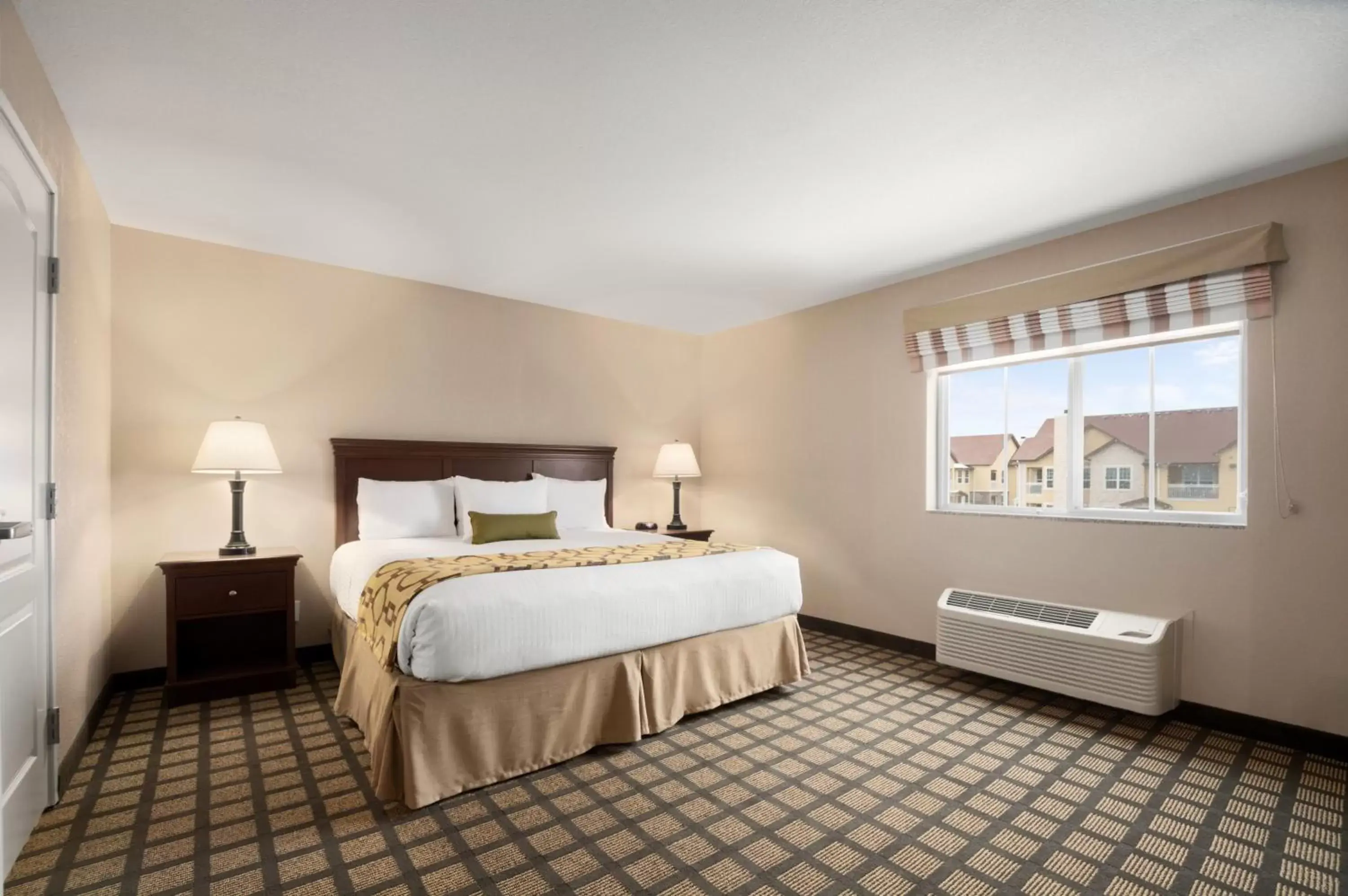 Bed in Baymont Inn & Suites by Wyndham Odessa