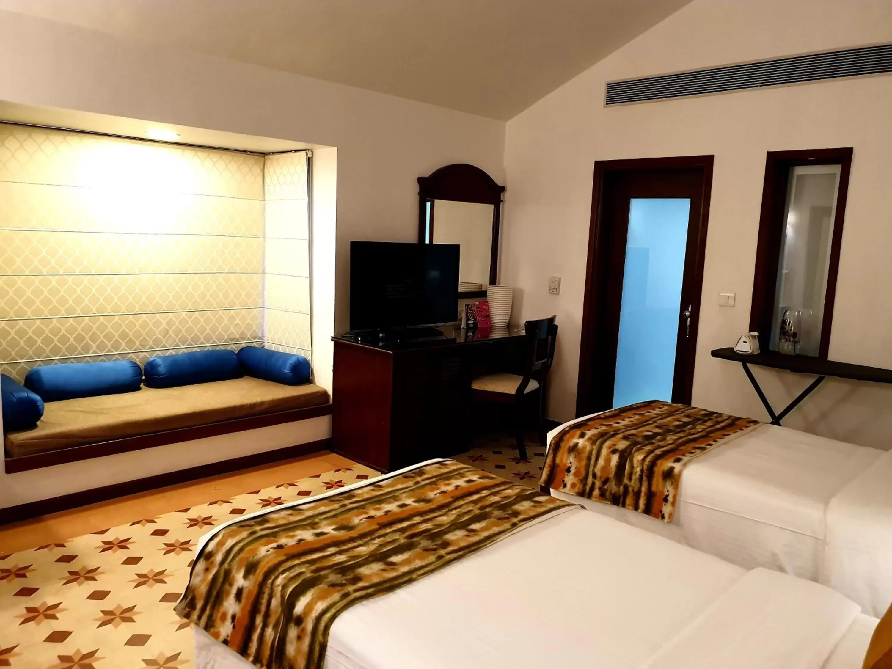 Bedroom, TV/Entertainment Center in Novotel Goa Dona Sylvia Resort