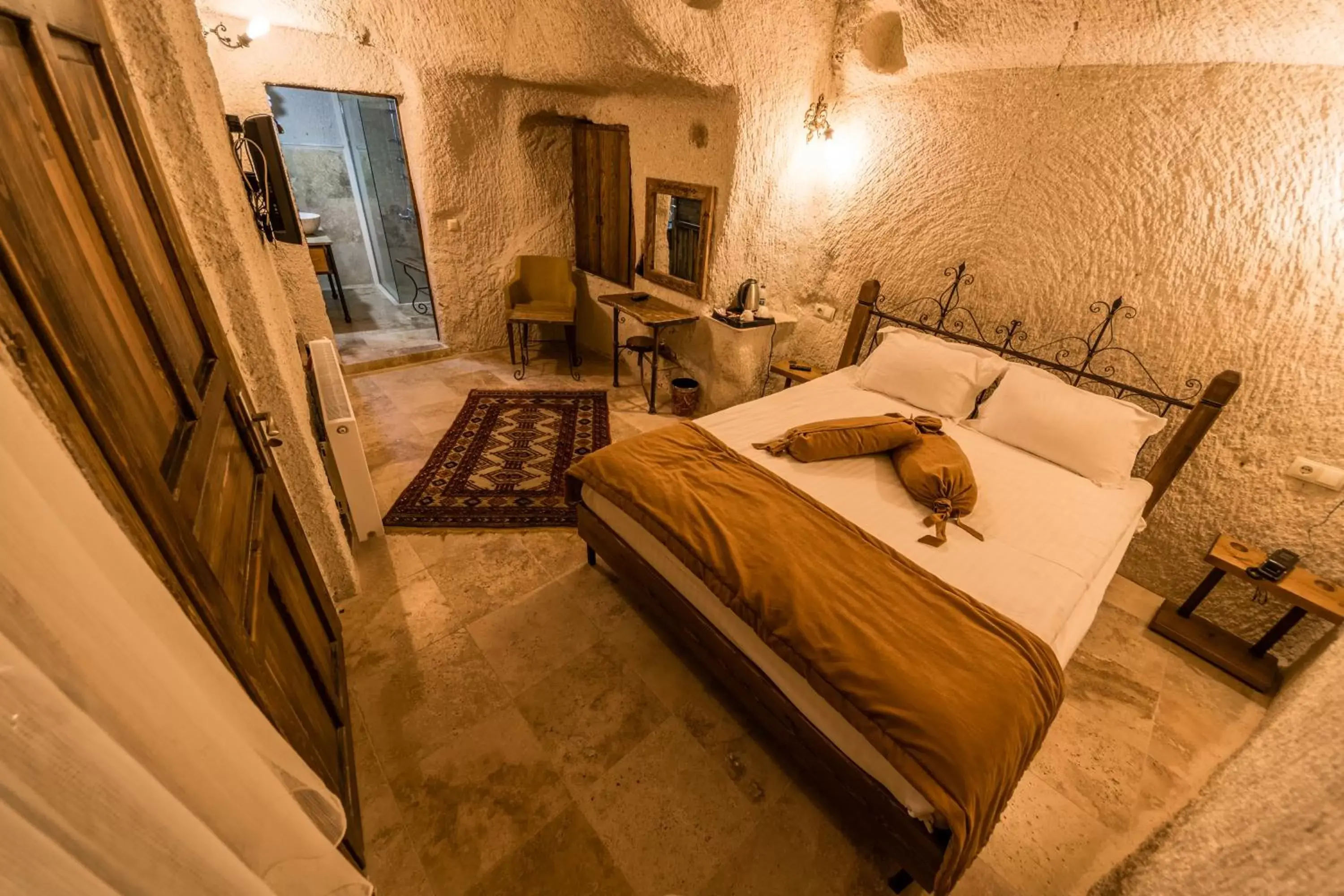 Bed in Elite Cave Suites