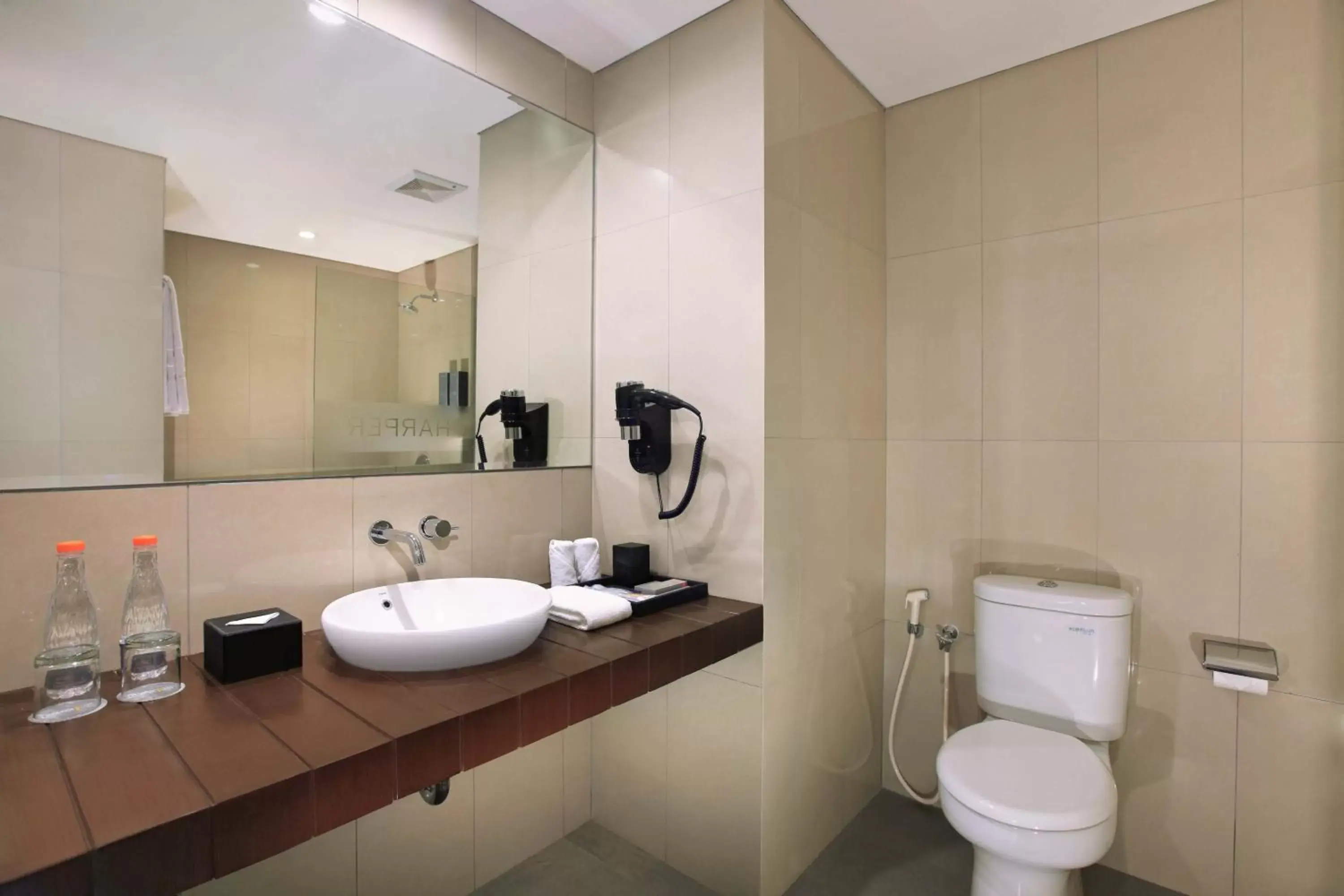 Bathroom in Harper Purwakarta by ASTON