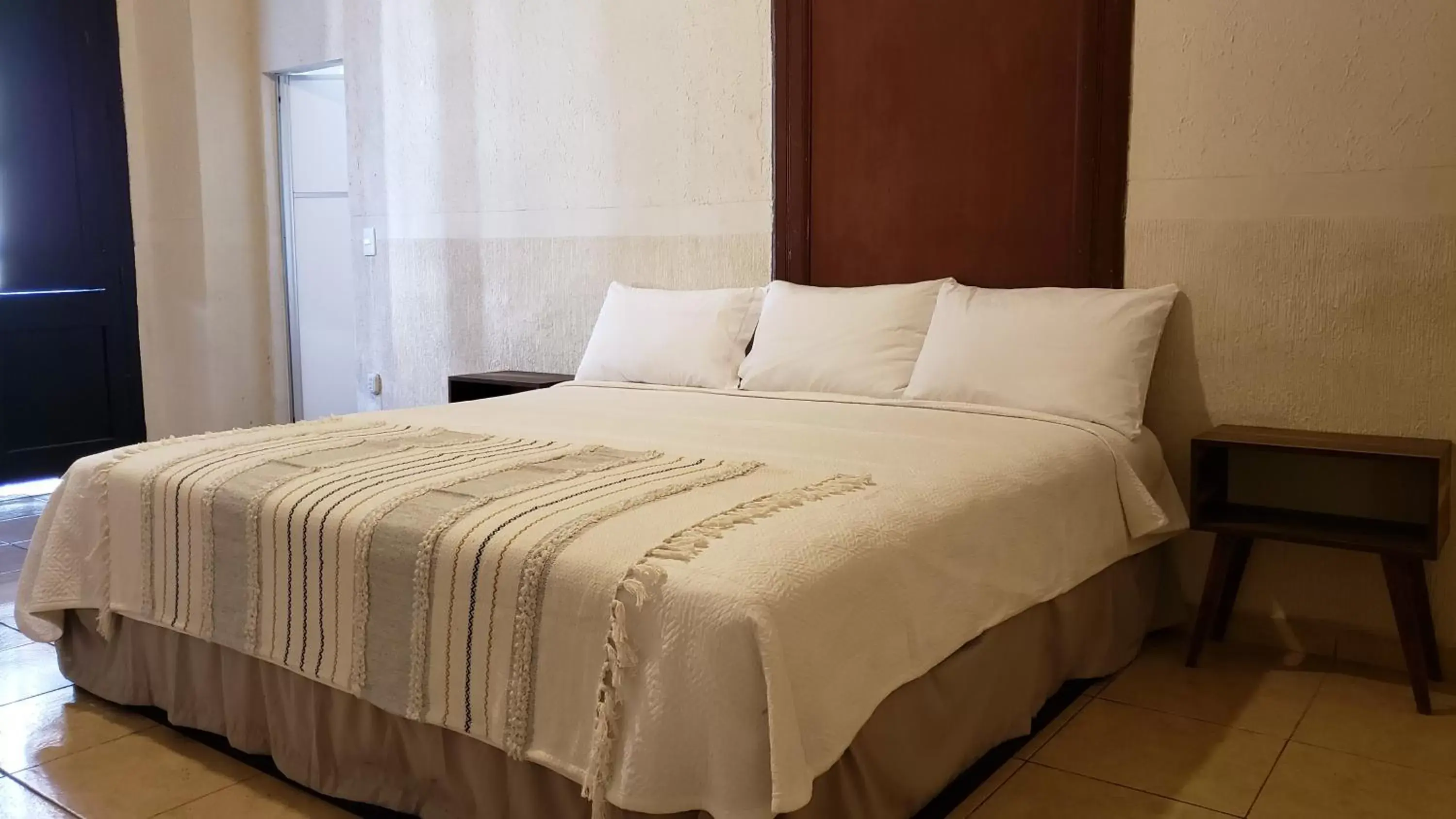 Bed in Hotel Grand Isitia