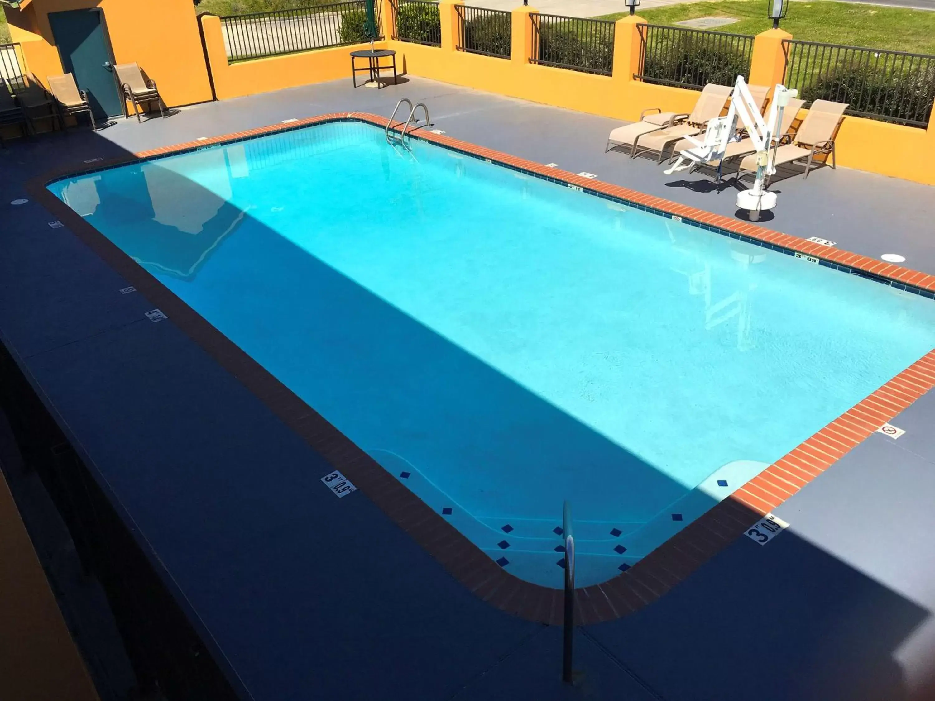 Swimming pool, Pool View in Americas Best Value Inn Denham Springs