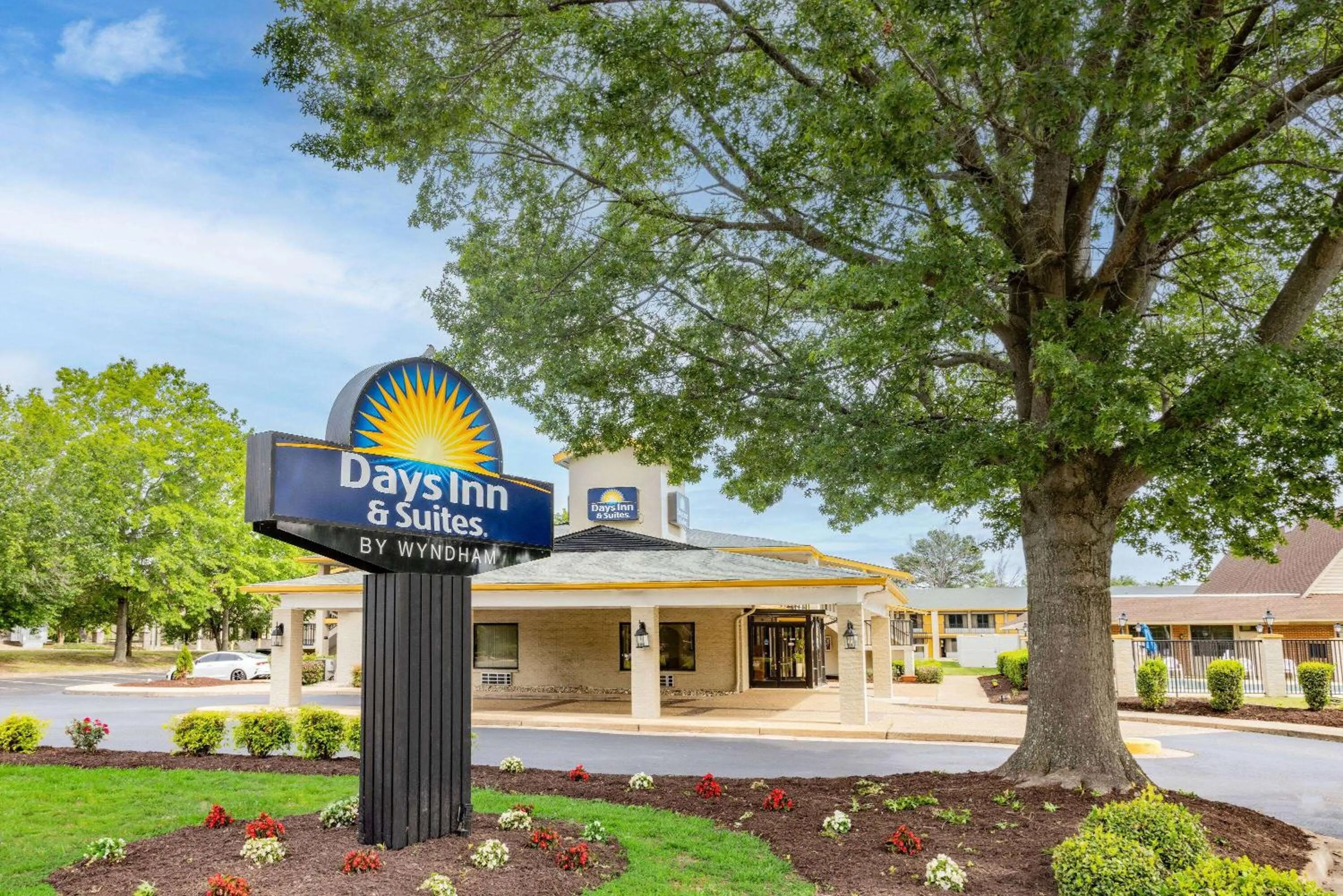 Property building in Days Inn & Suites by Wyndham Colonial