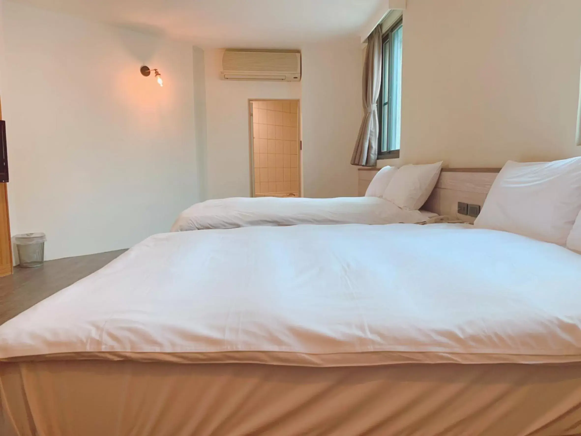 Bed in Raise Hotel Taichung
