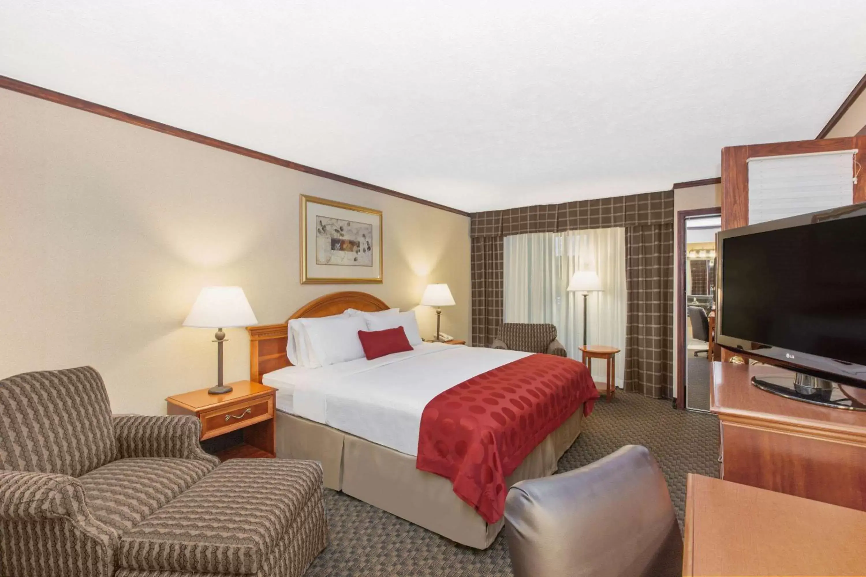 Photo of the whole room, Bed in Ramada by Wyndham Midtown Grand Island