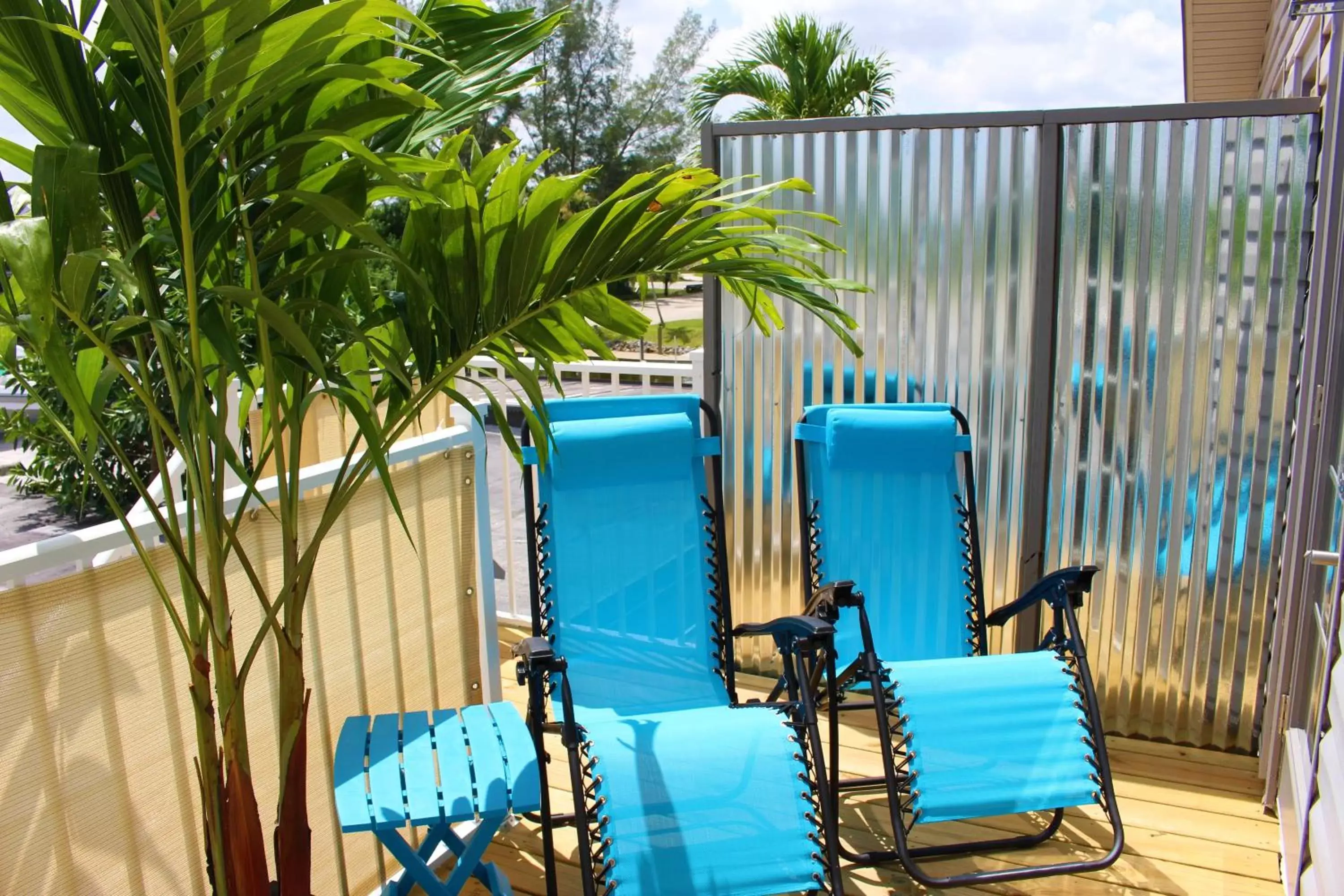 Balcony/Terrace, Swimming Pool in Latitude 26 Waterfront Boutique Resort - Bonita Springs