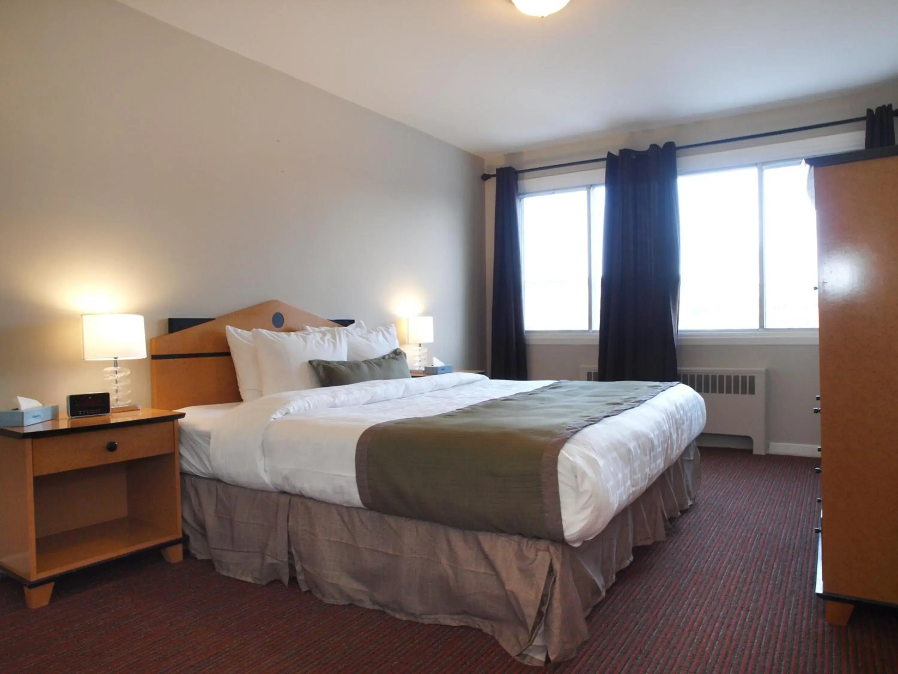 Bed in Beausejour Hotel Apartments/Hotel Dorval