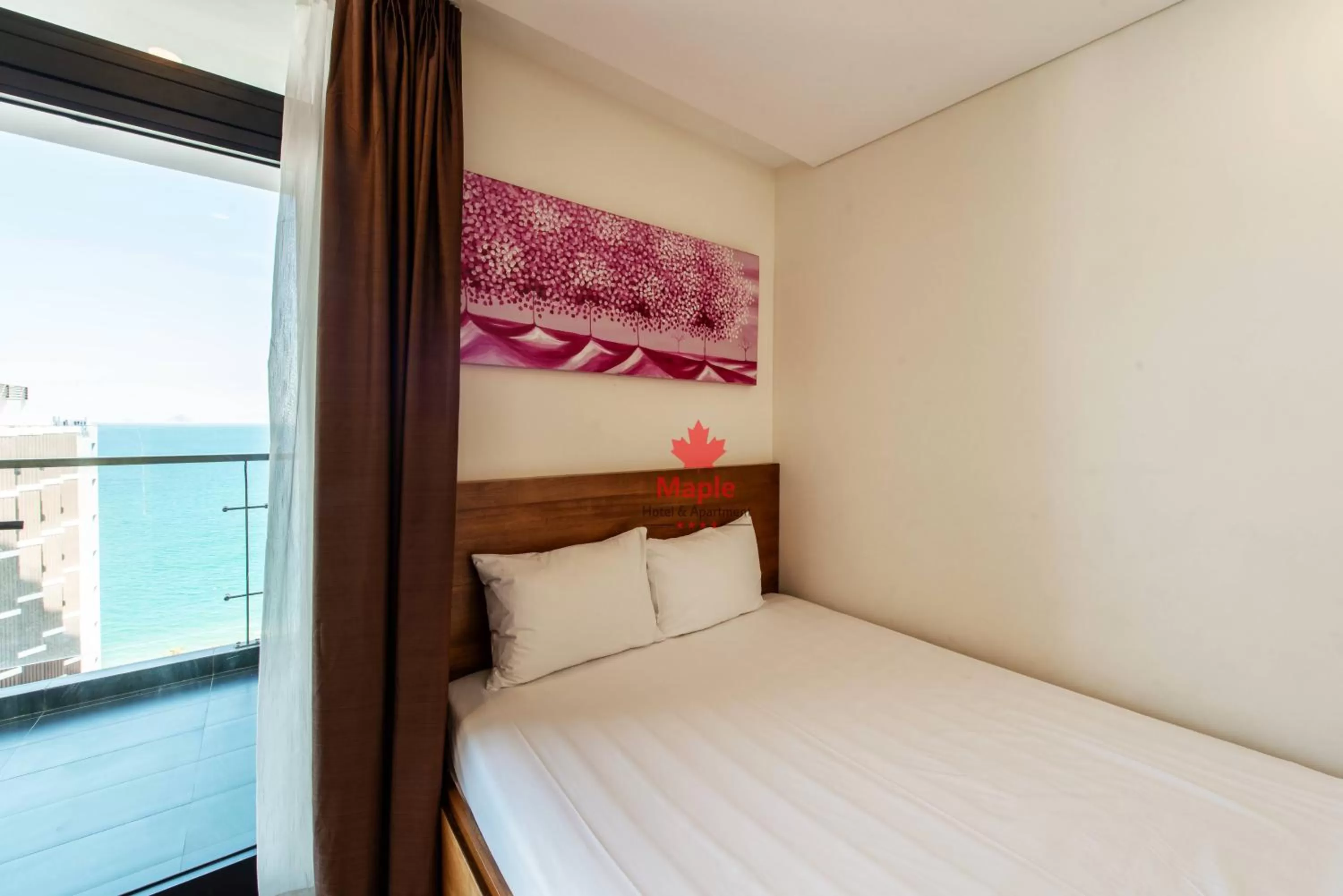 Bed in Maple Hotel & Apartment