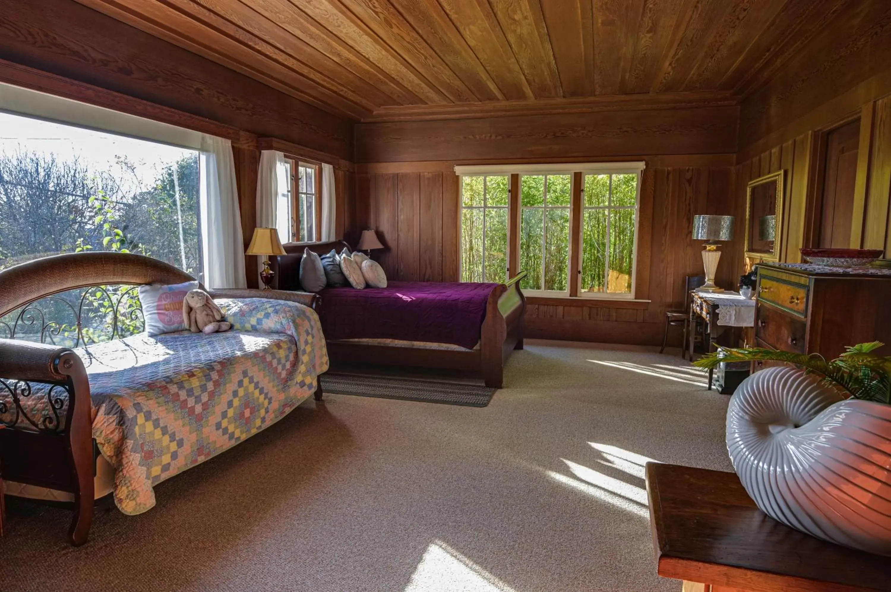 Bed, Seating Area in The Captains Quarters