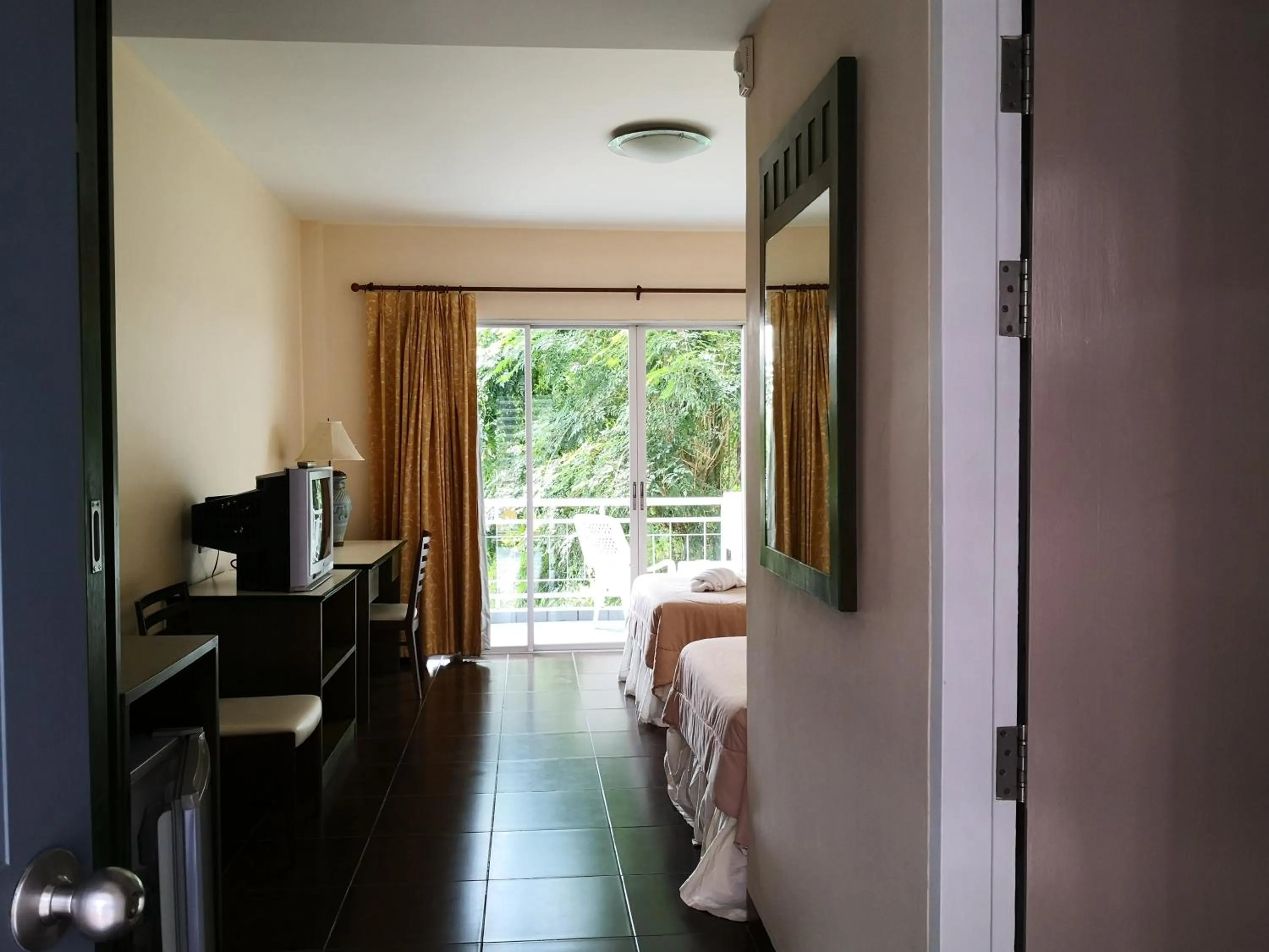 Bed in Baan Suksiri Hotel