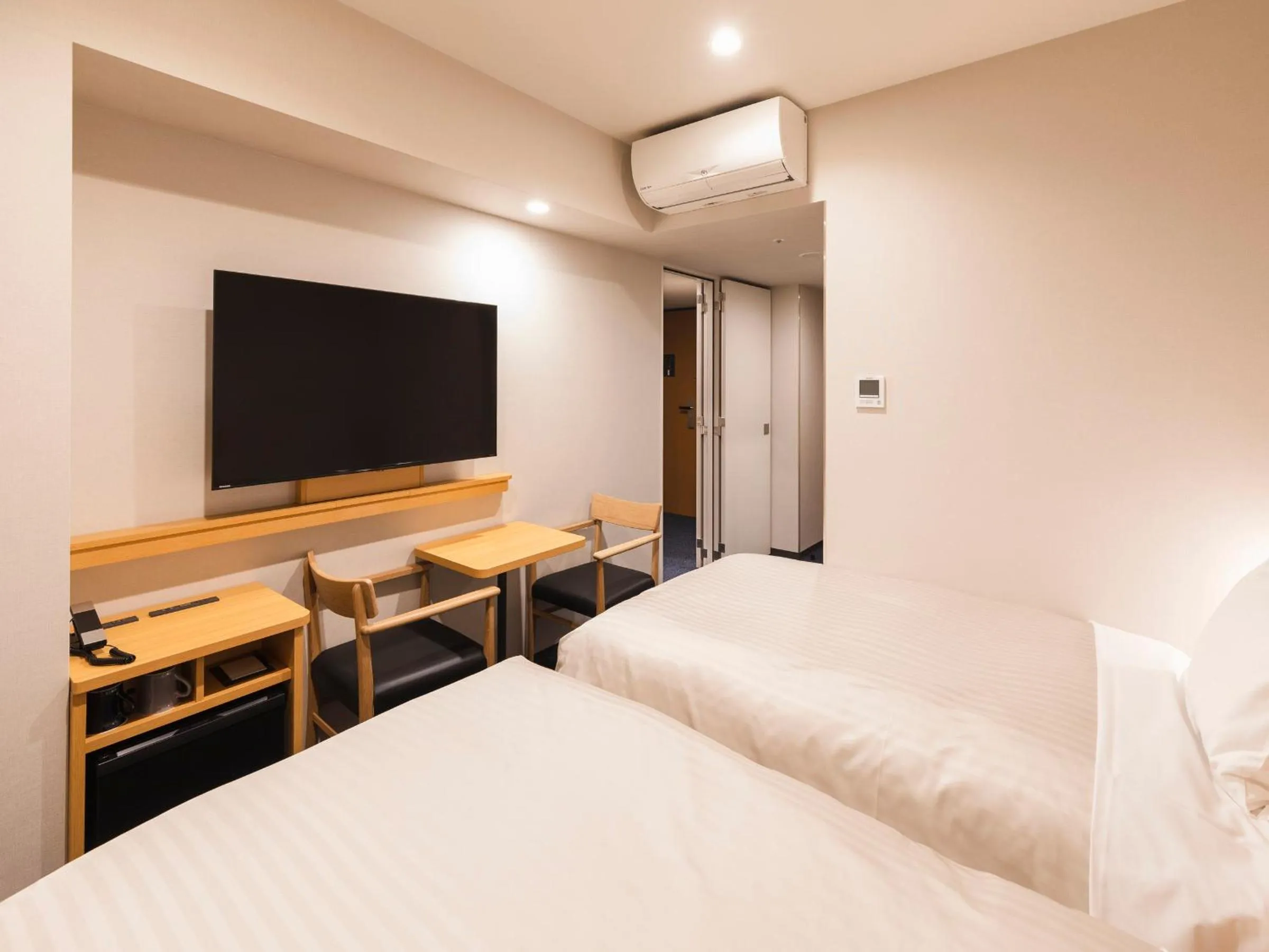 Bed in Sotetsu Fresa Inn Daimon