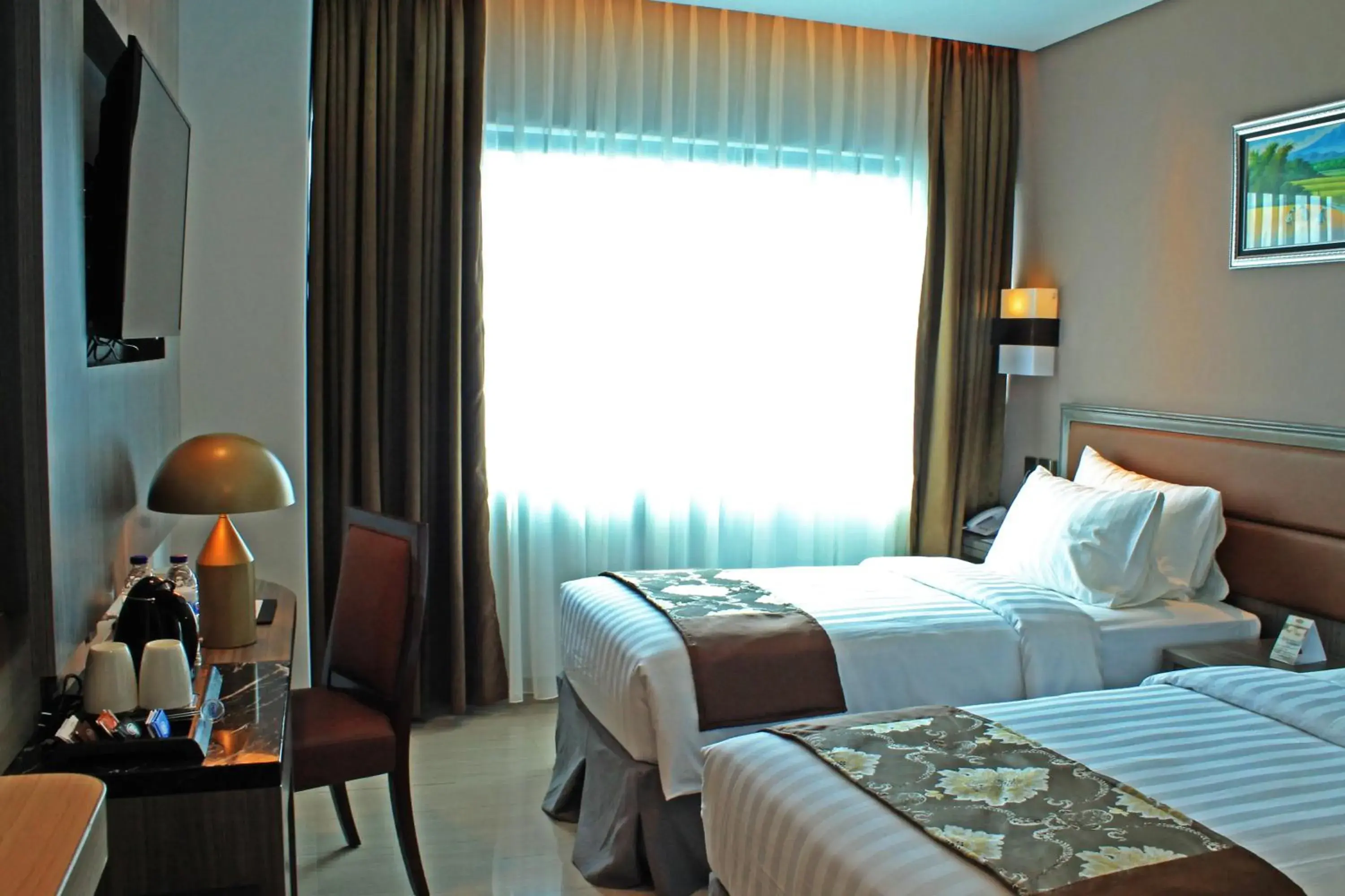 Photo of the whole room, Bed in Arthama Hotels Losari Makassar