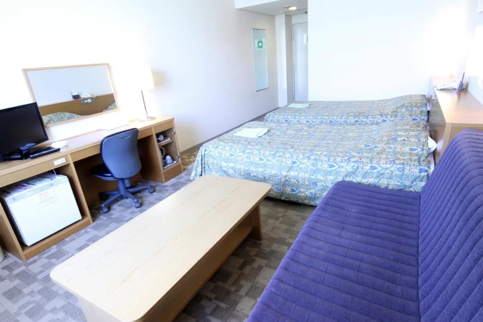 Bed in Hotel Hiroshima Sunplaza