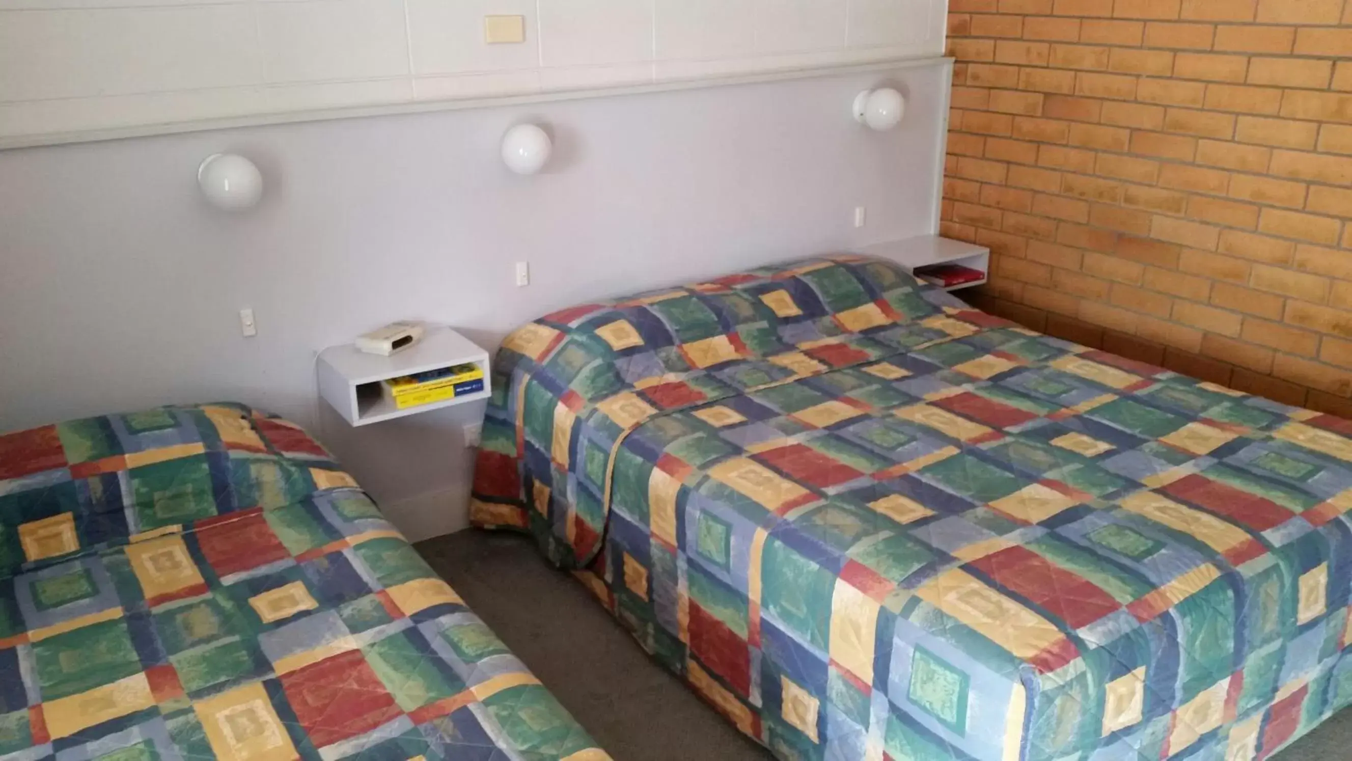 Bed in Tweed River Motel