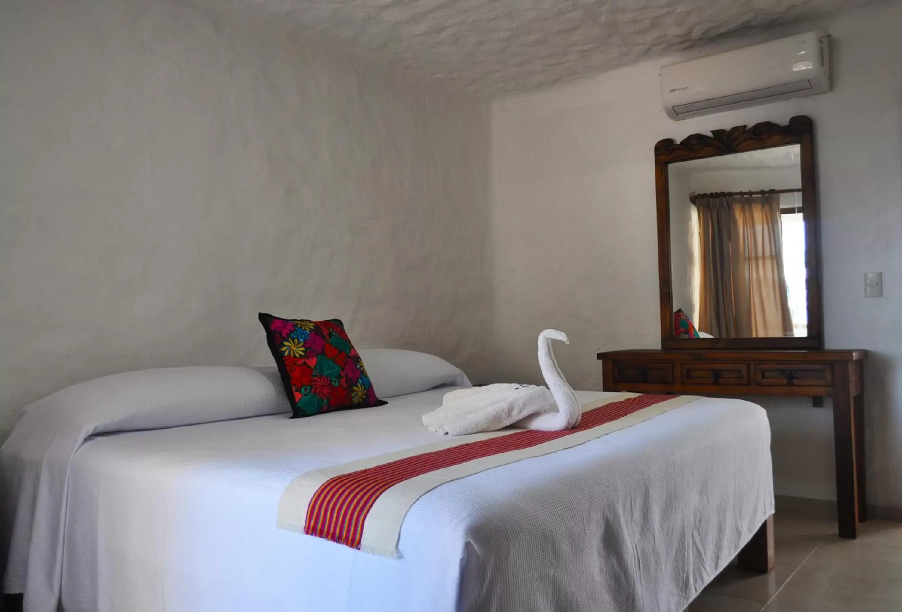Bed in Petit Hotel Pilitas
