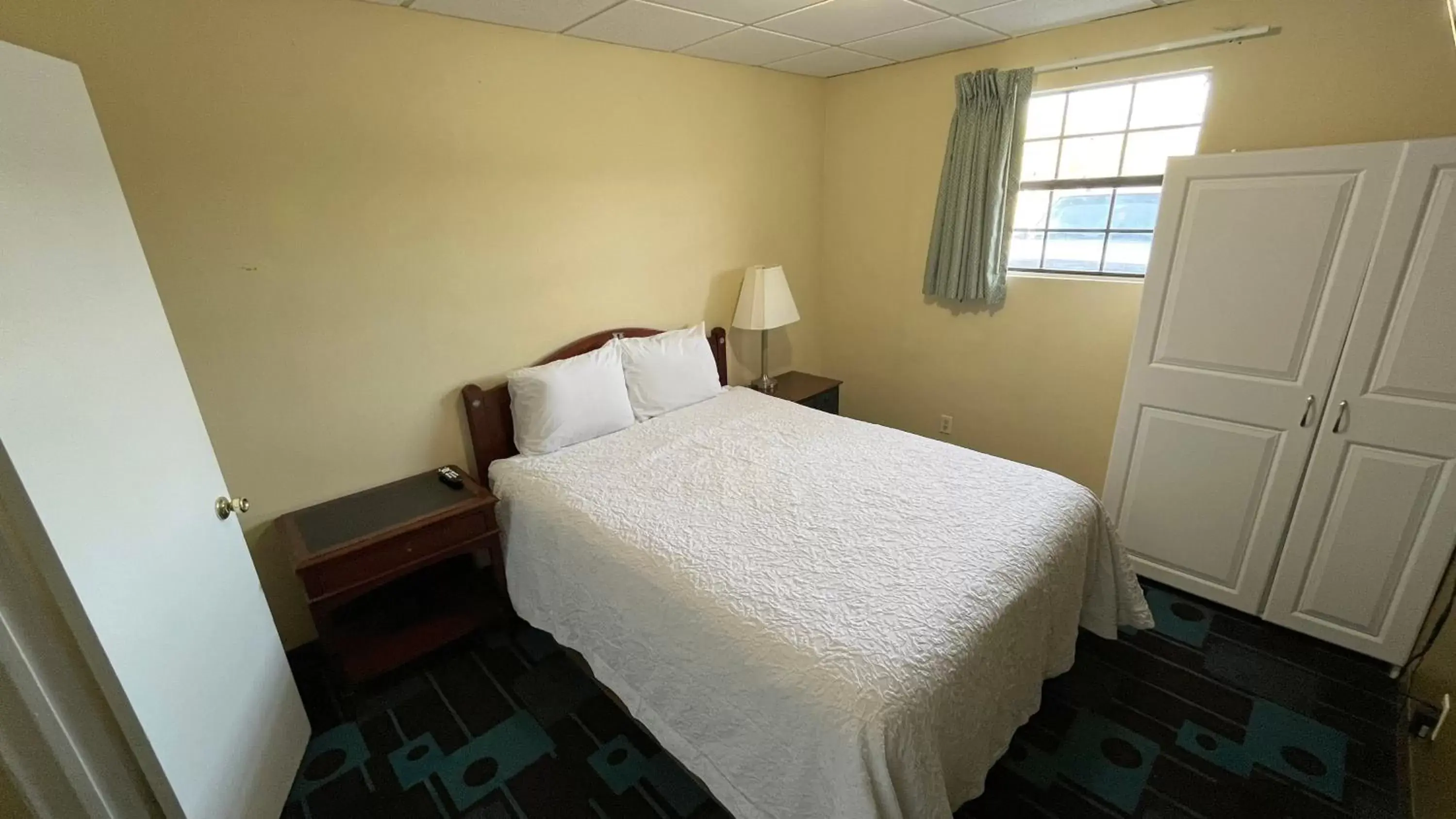 Bed in Extended Stay Motel - Snyder