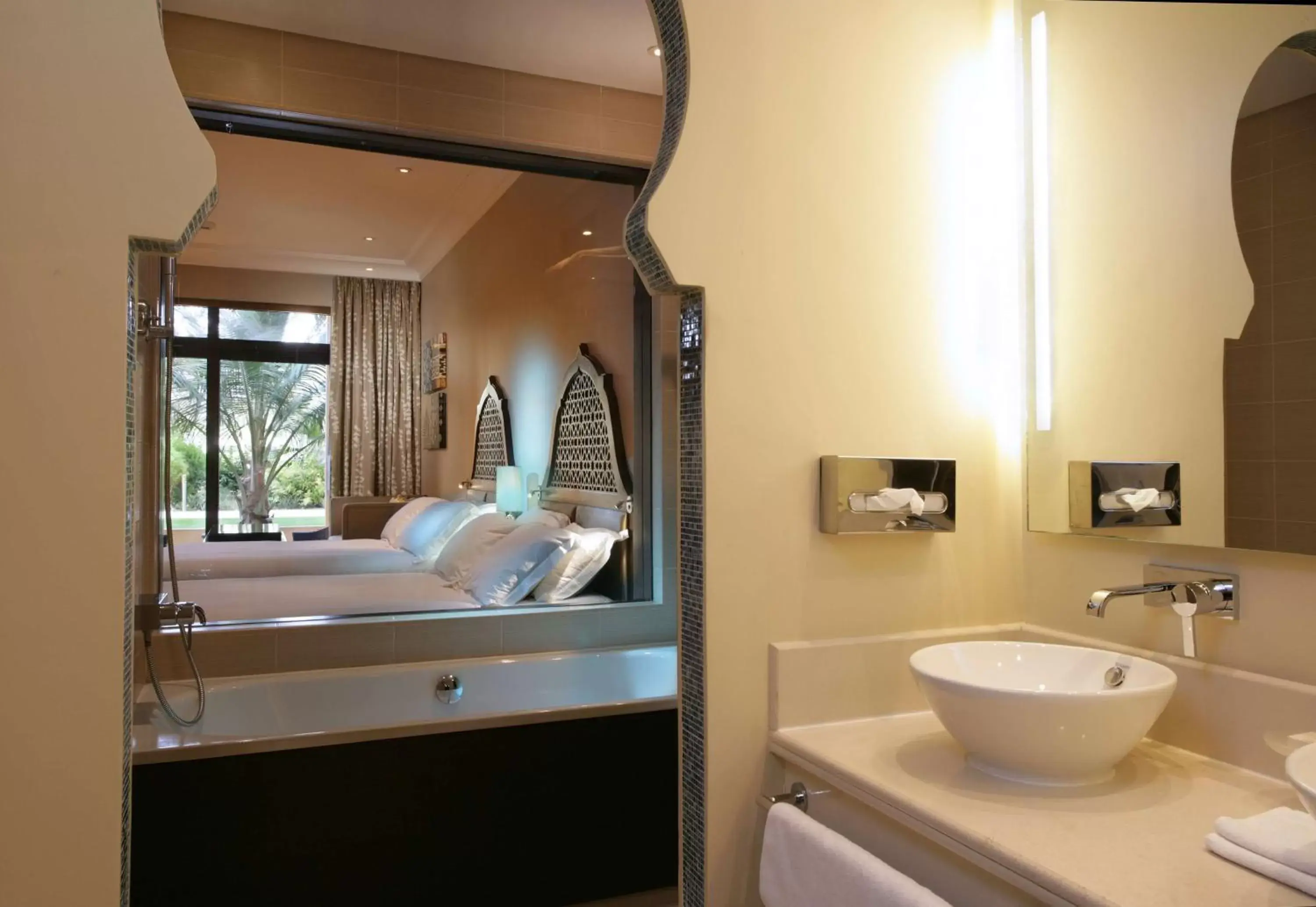 Bed, Bathroom in Hilton Ras Al Khaimah Beach Resort