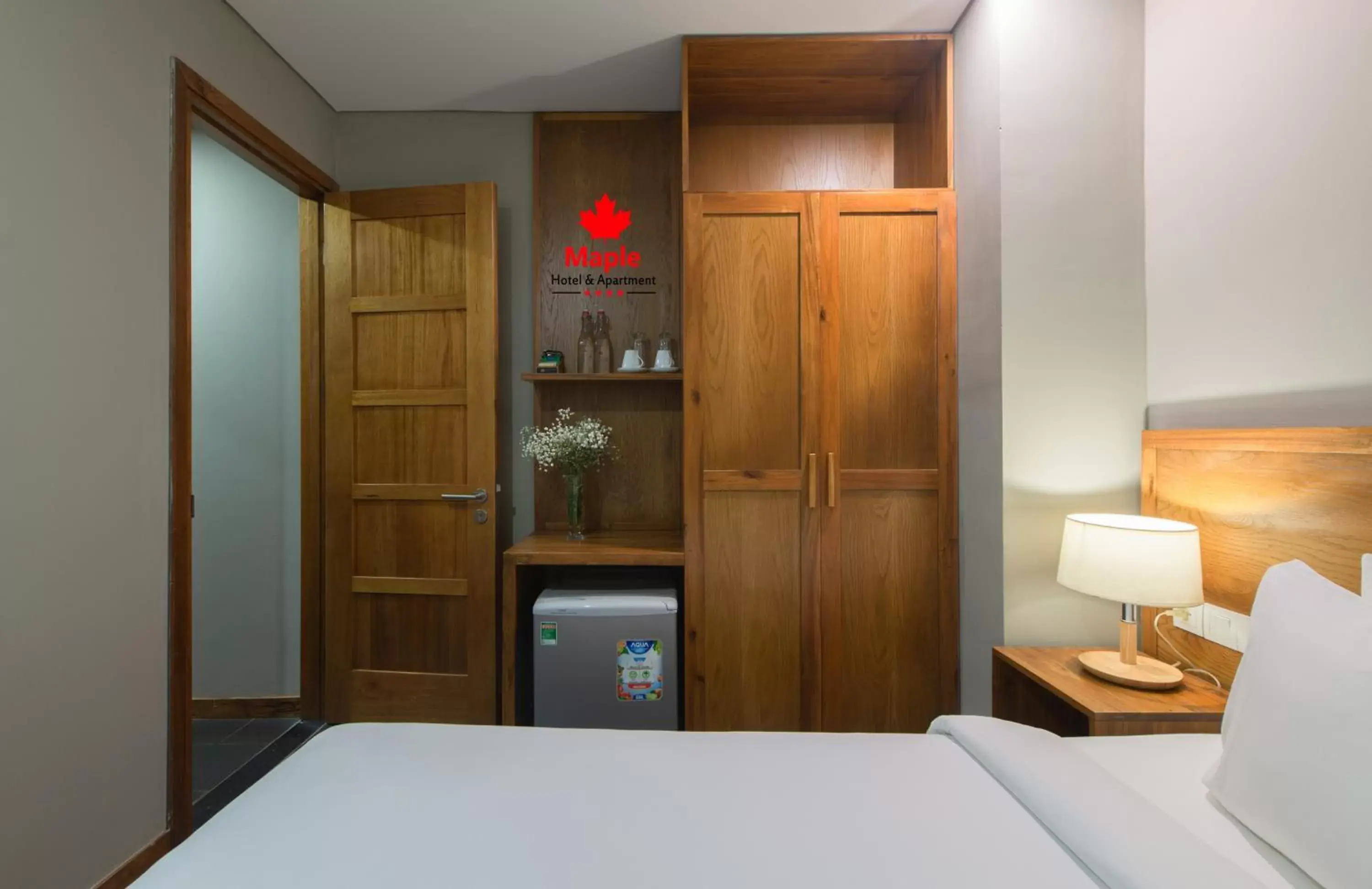 wardrobe, Bed in Maple Hotel & Apartment